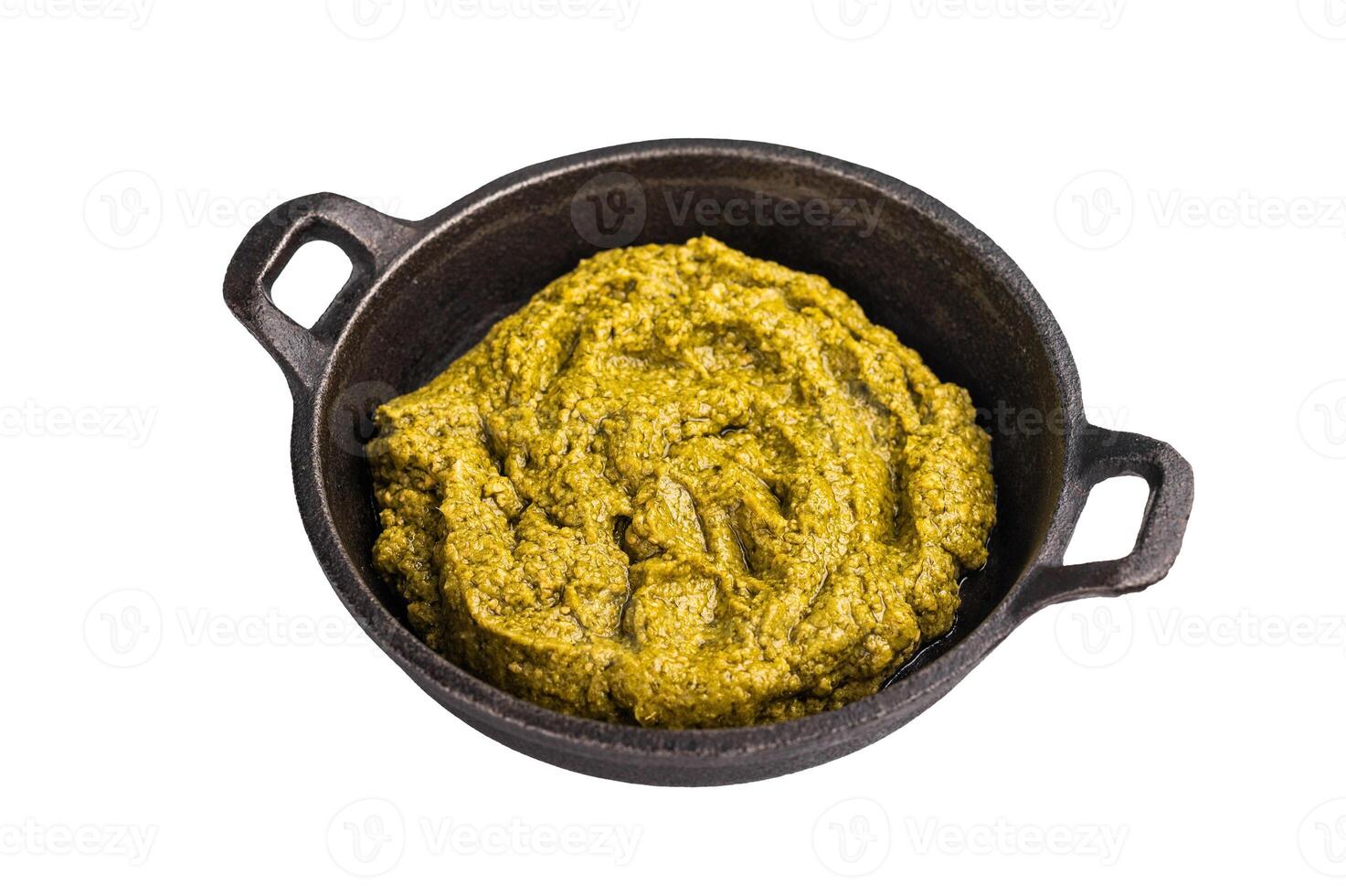 Basil Pesto sauce, Iitalian sauce in a skillet isolated on white background photo