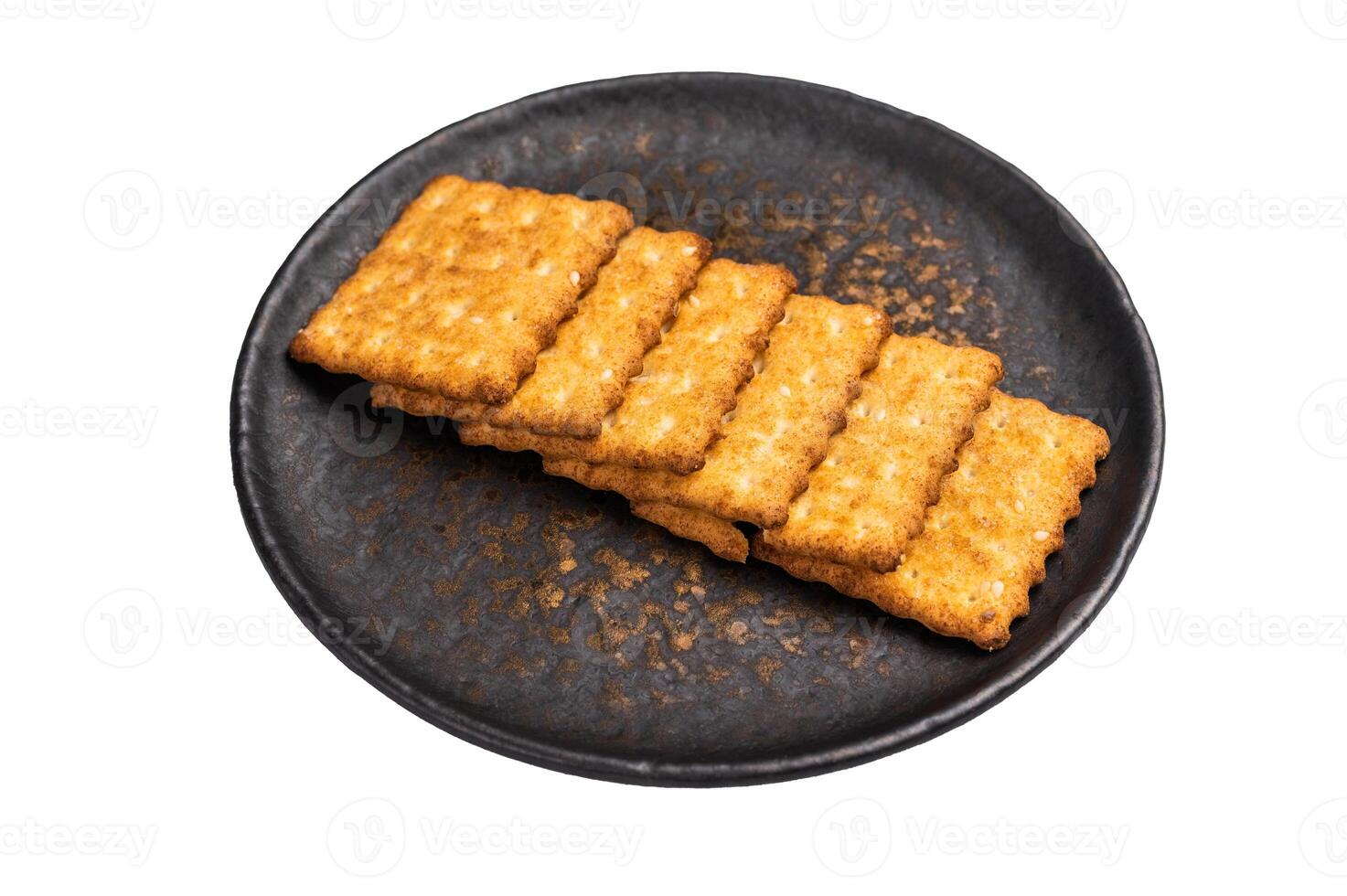 Heap of square Wholemeal salt crackers isolated on white background, top view. photo