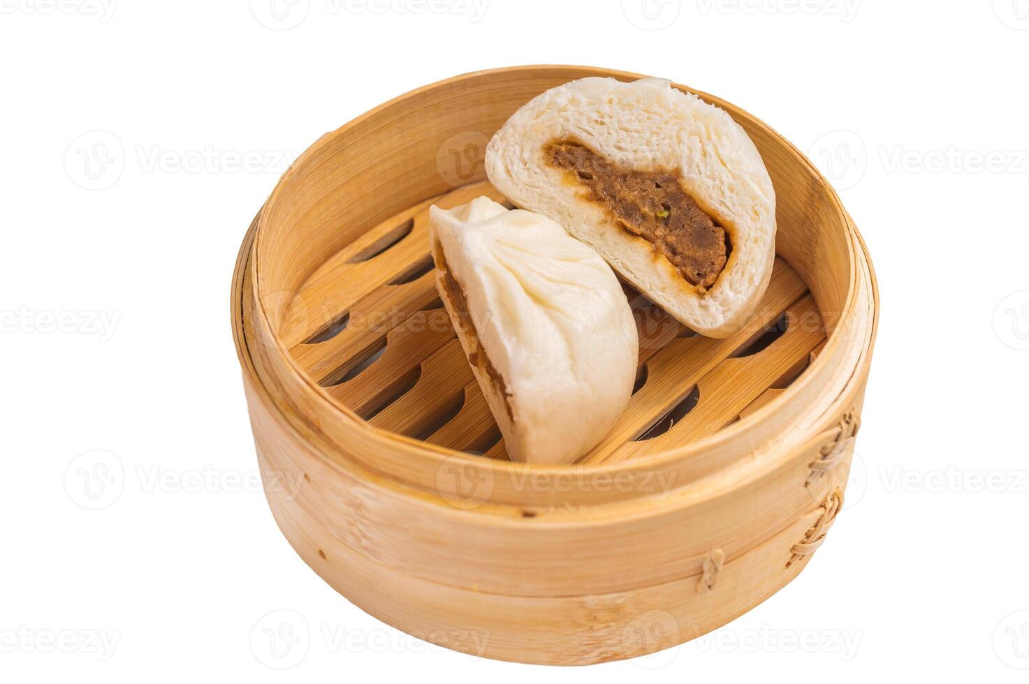 Baozi Bun, Chinese Steamed bun with pork meat in bamboo steamer isolated on white background. top view photo