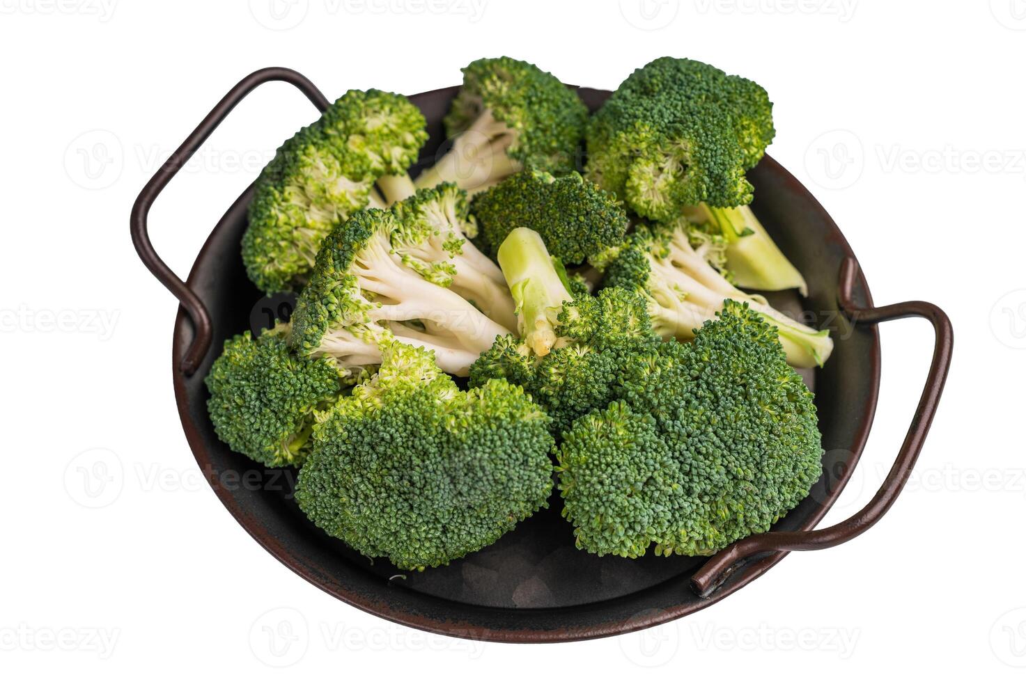 Green fresh broccoli pieces in a steel tray isolated on white background. top view photo