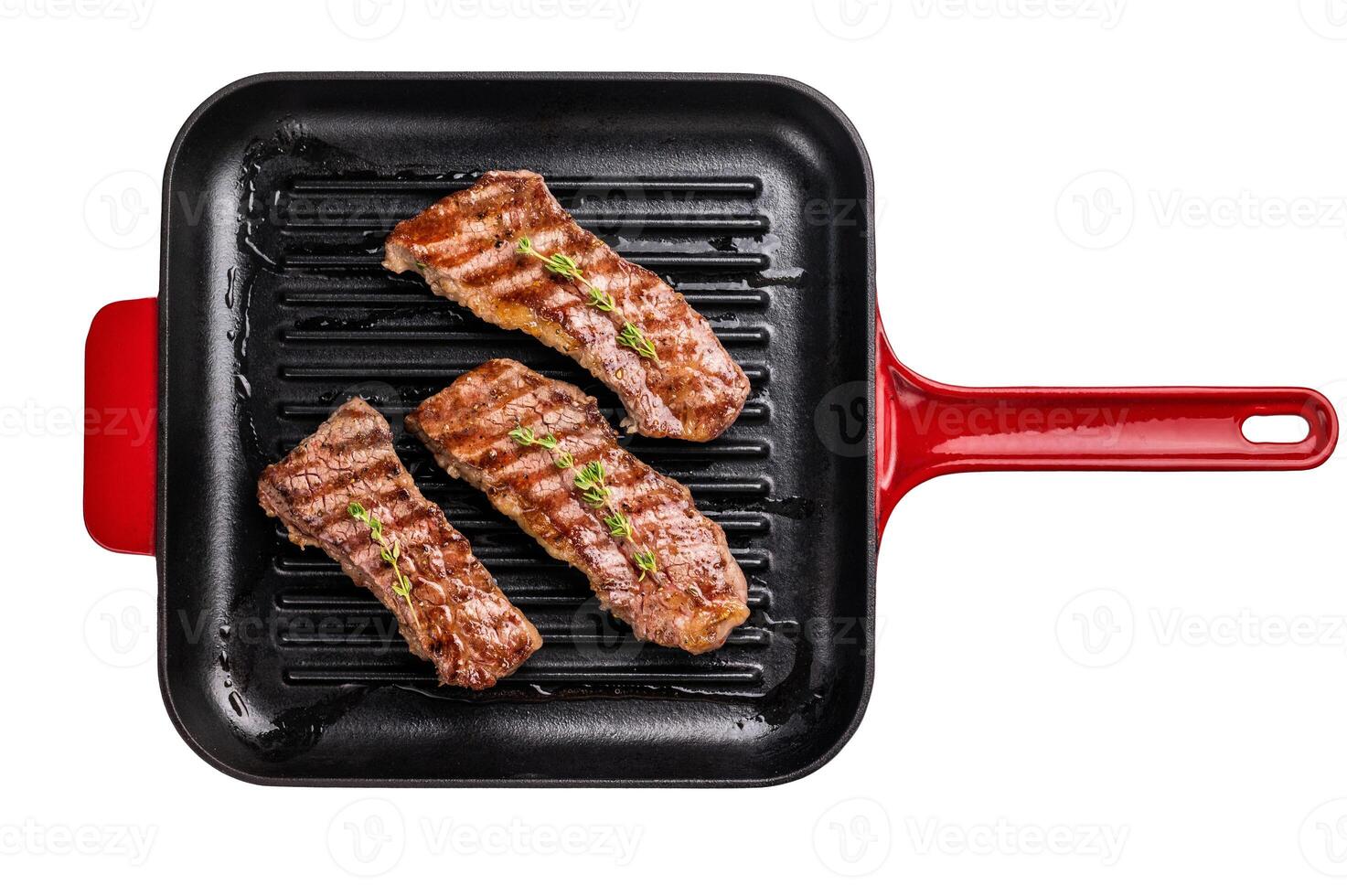 Grilled Tri tip steaks, marbled beef meat on pan with herbs isolated on white background photo