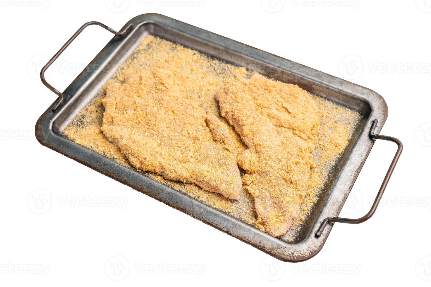 Fresh breaded Raw Wiener Schnitzel steak prepared for frying isolated on white background photo
