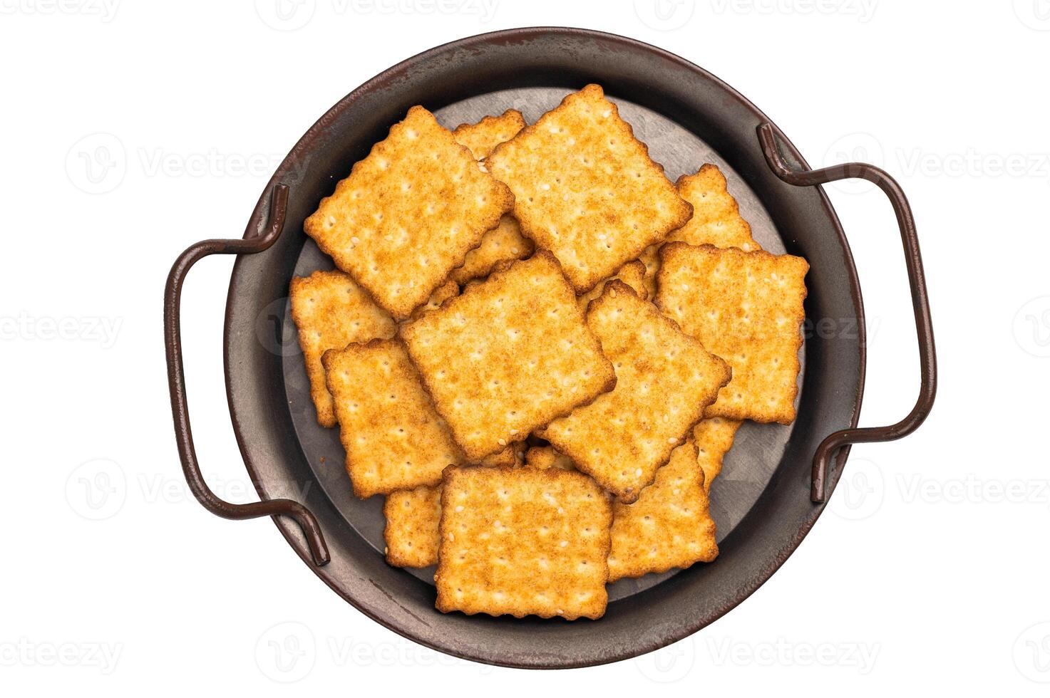 Square salty crackers in wooden tray isolated on white background, top view photo
