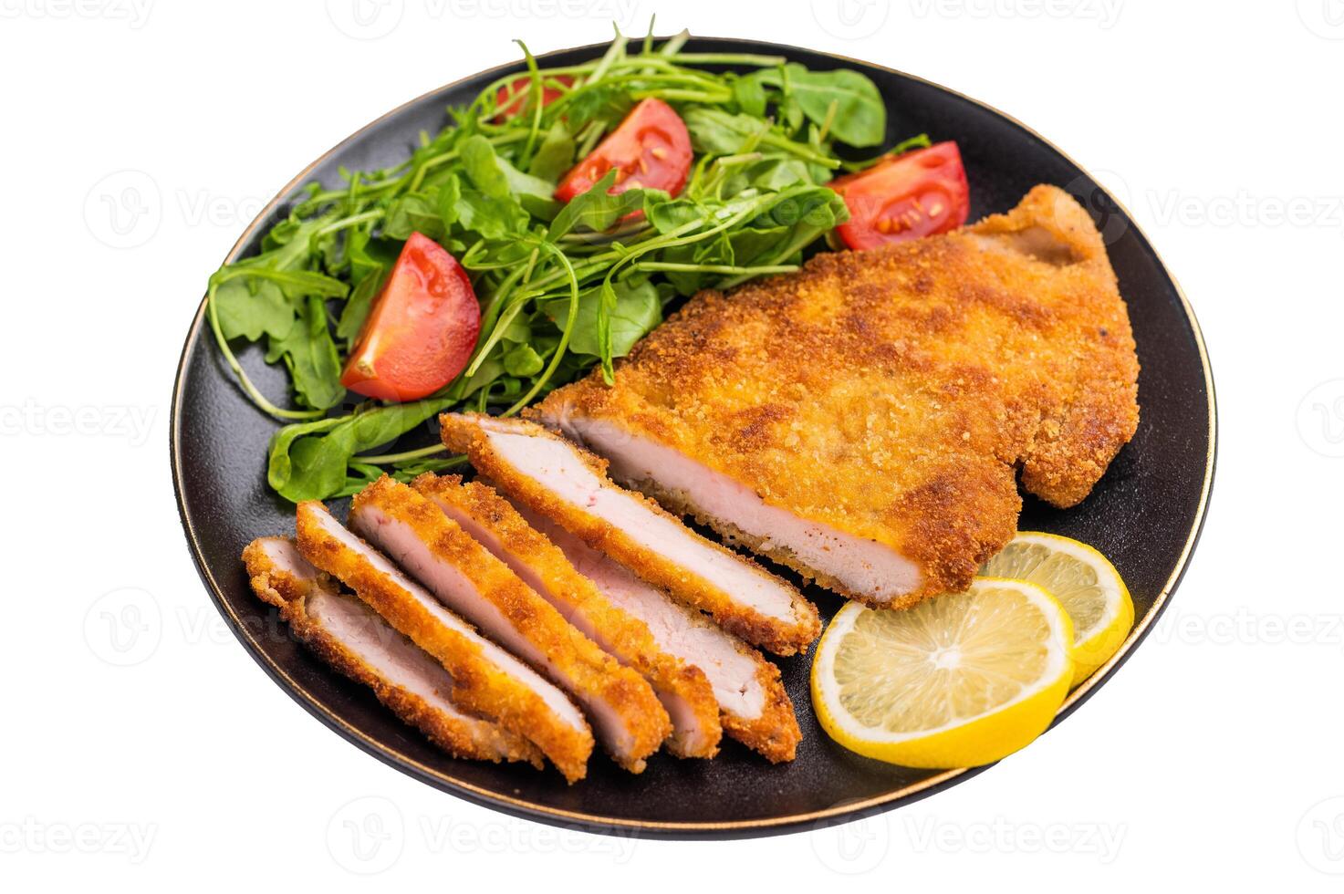 Roast Weiner schnitzel steak, veal breaded meat with salad isolated on white background photo