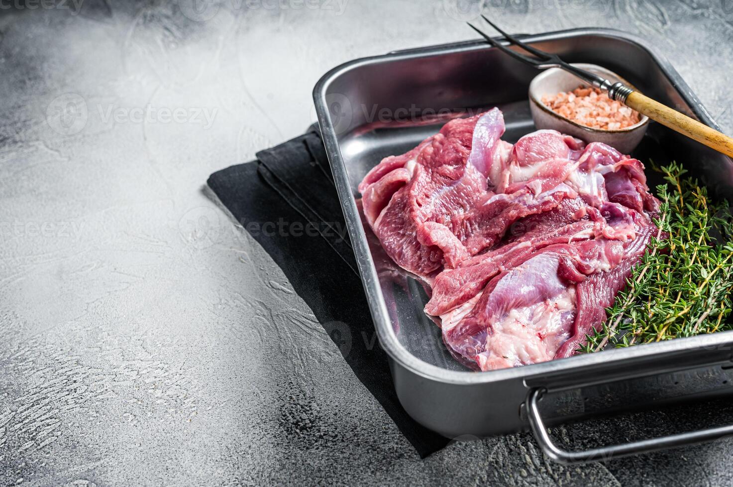 Ready for cooking raw Turkey thigh fillet meat. White background. Top view. Space for text photo