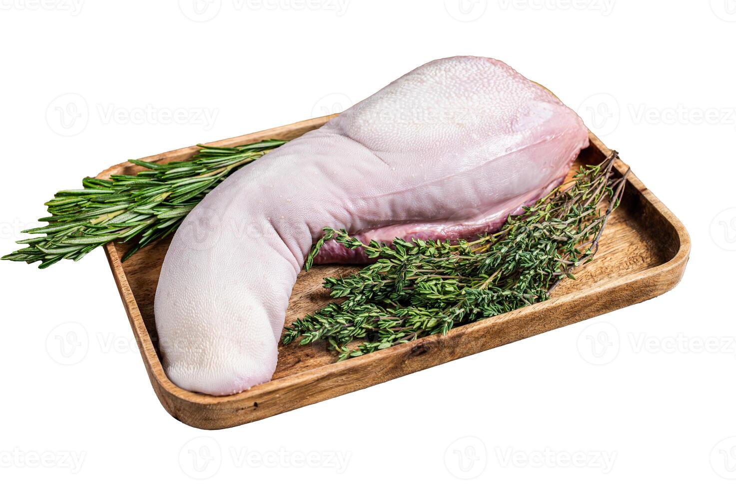 Raw pork tongue on butcher tray with meat knife. Isolated on white background. Top view. photo