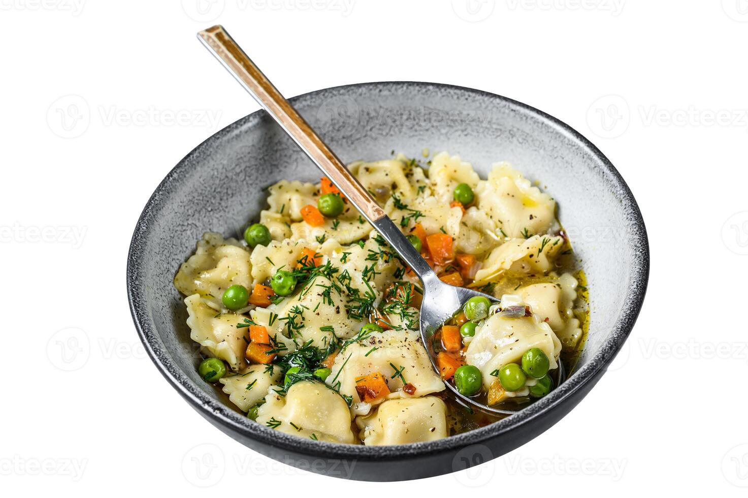 Ravioli Soup dumplings pasta in a bowl with greens. Isolated on white background. Top view. photo