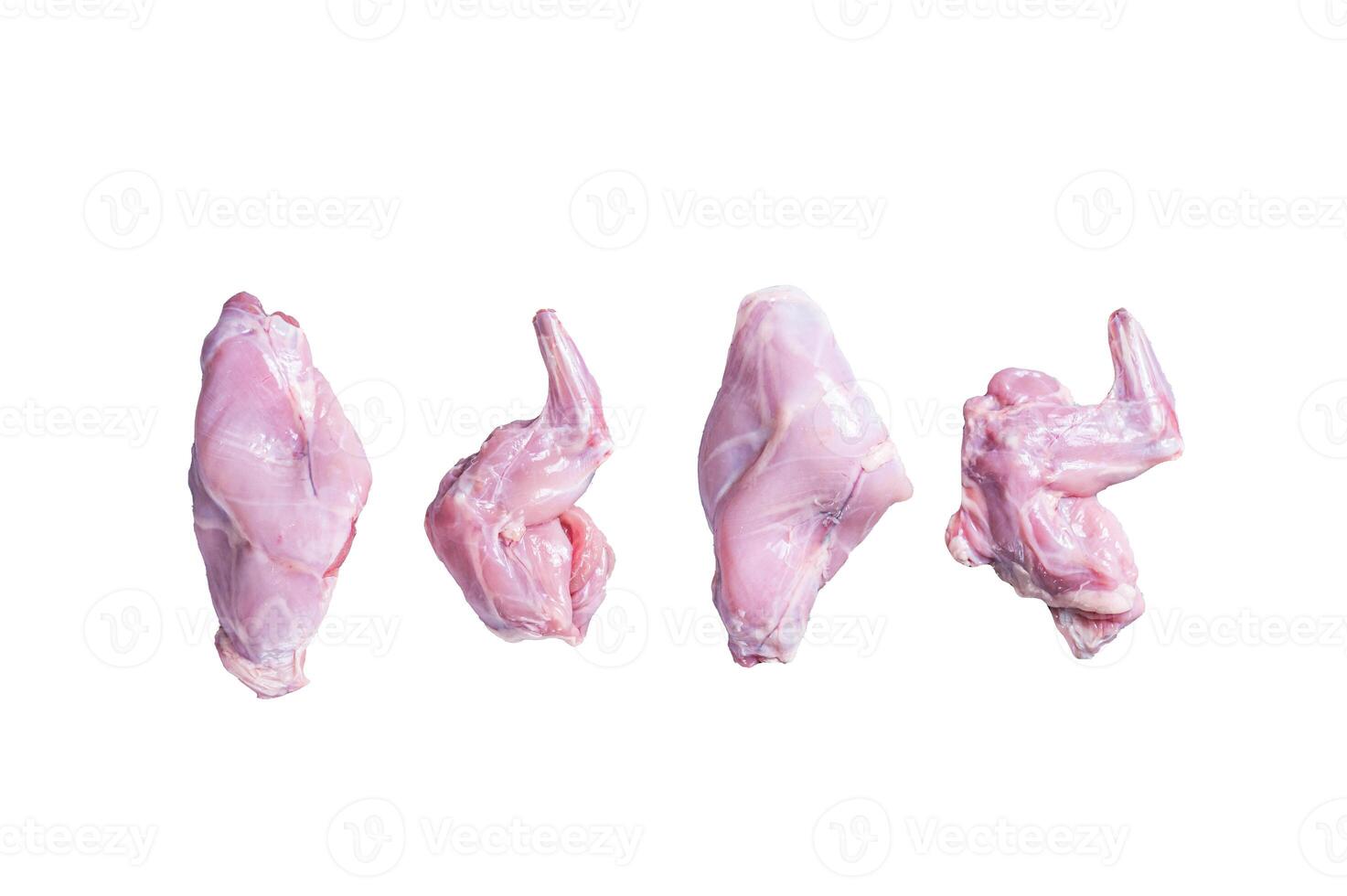 Raw rabbit legs slices on a butcher board. Isolated on white background. photo