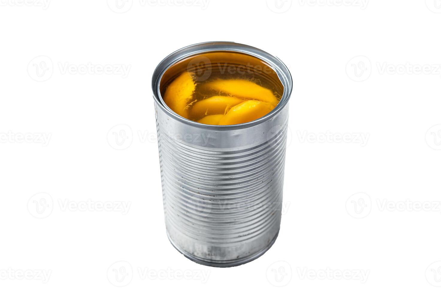 Canned mango slices in syrup in a metal can. Isolated on white background. photo