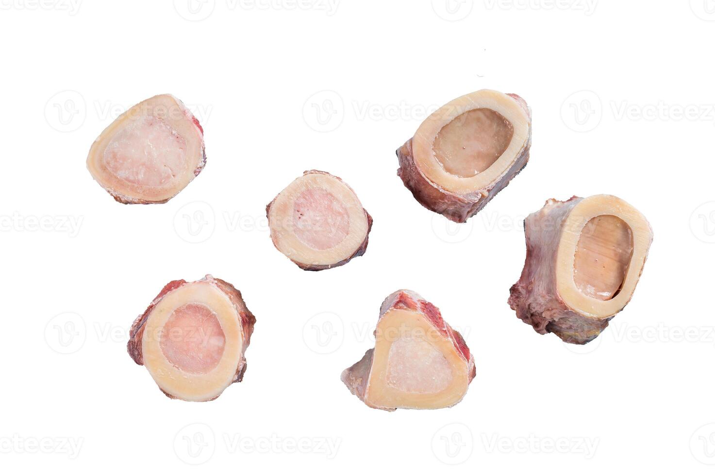 Raw calf Marrow bones on butcher table. Isolated on white background. photo
