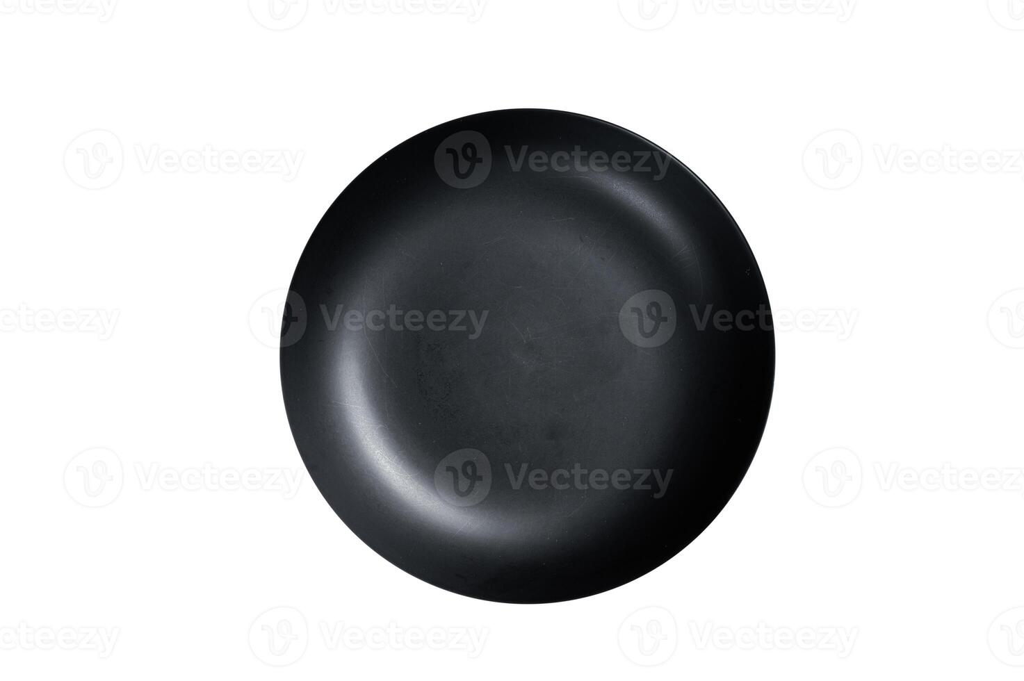 Empty black craft plate on table. Table setting. Isolated on white background. photo