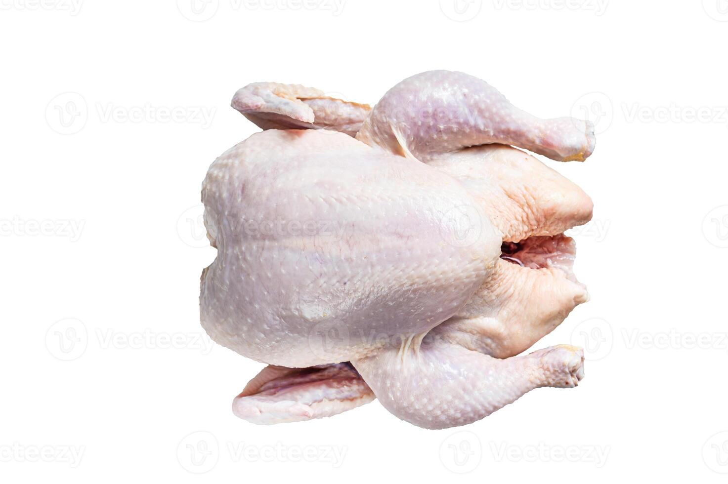 Raw free range whole chicken on a kitchen table. Isolated on white background. photo