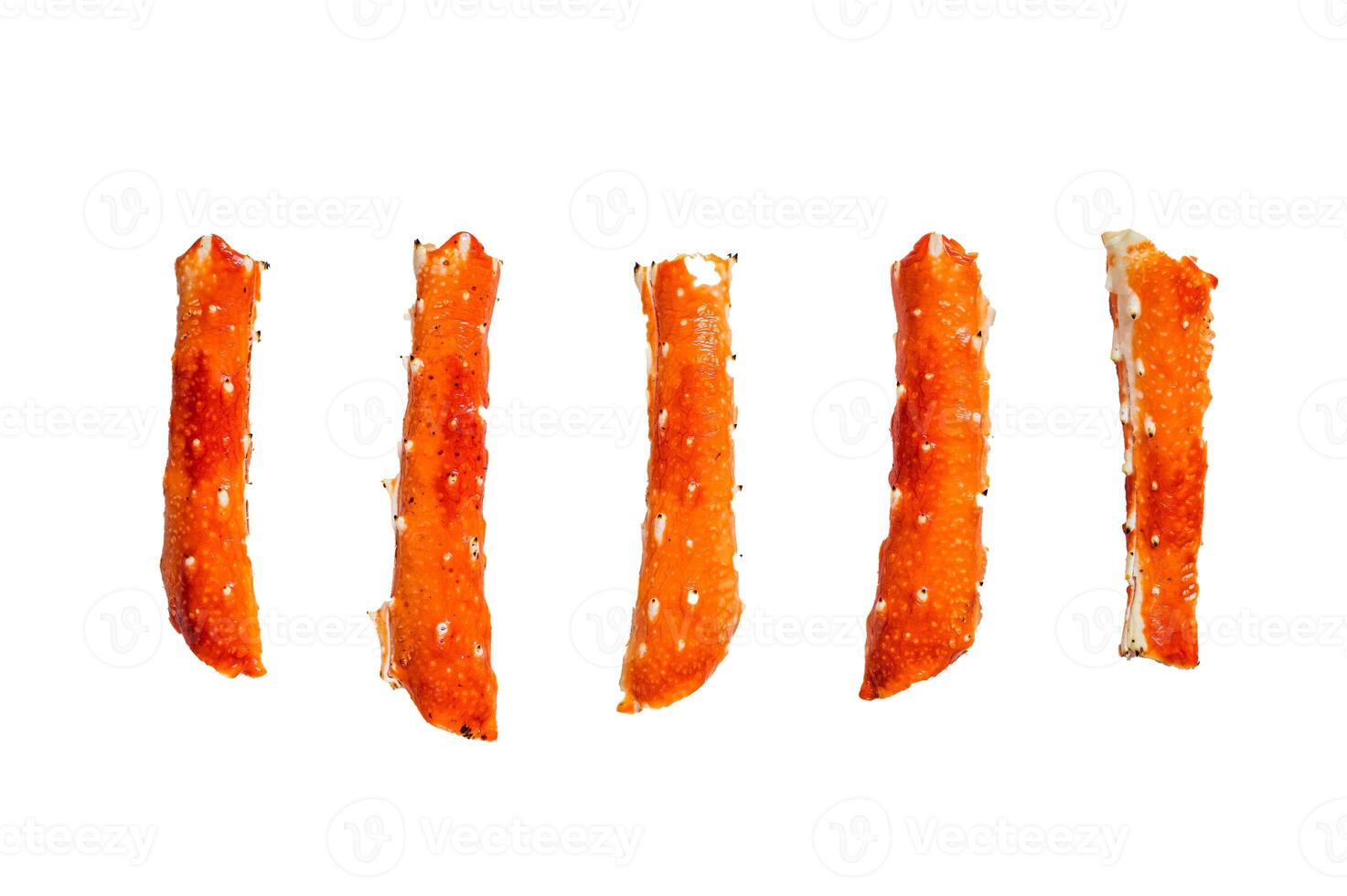 Crab legs Phalanx on a kitchen table. Isolated on white background. photo