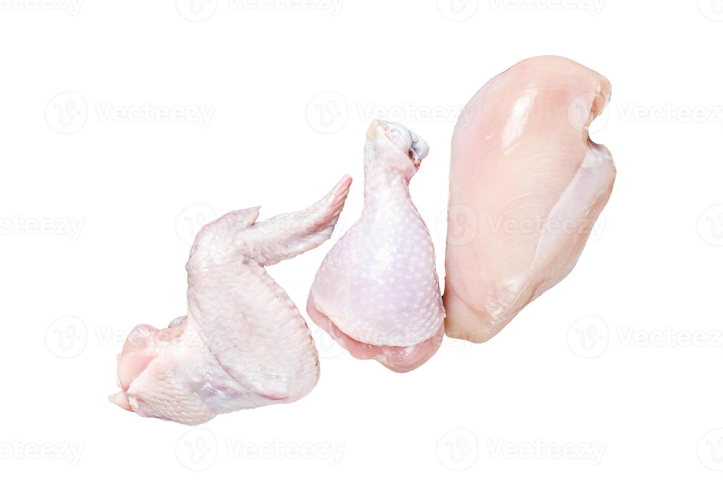 Raw chicken portions for cooking and barbecuing with skinless breasts, drumstick and wings Isolated on white background. Top view. photo
