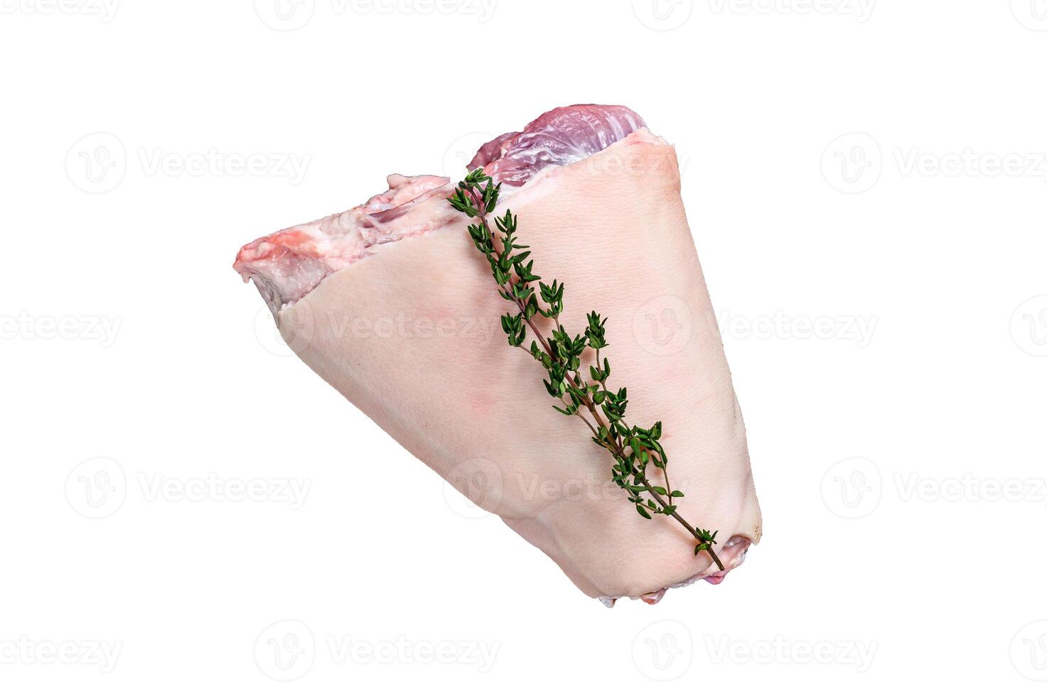 Raw Pork knuckle leg meat on kitchen table with herbs. High quality Isolate, white background. photo