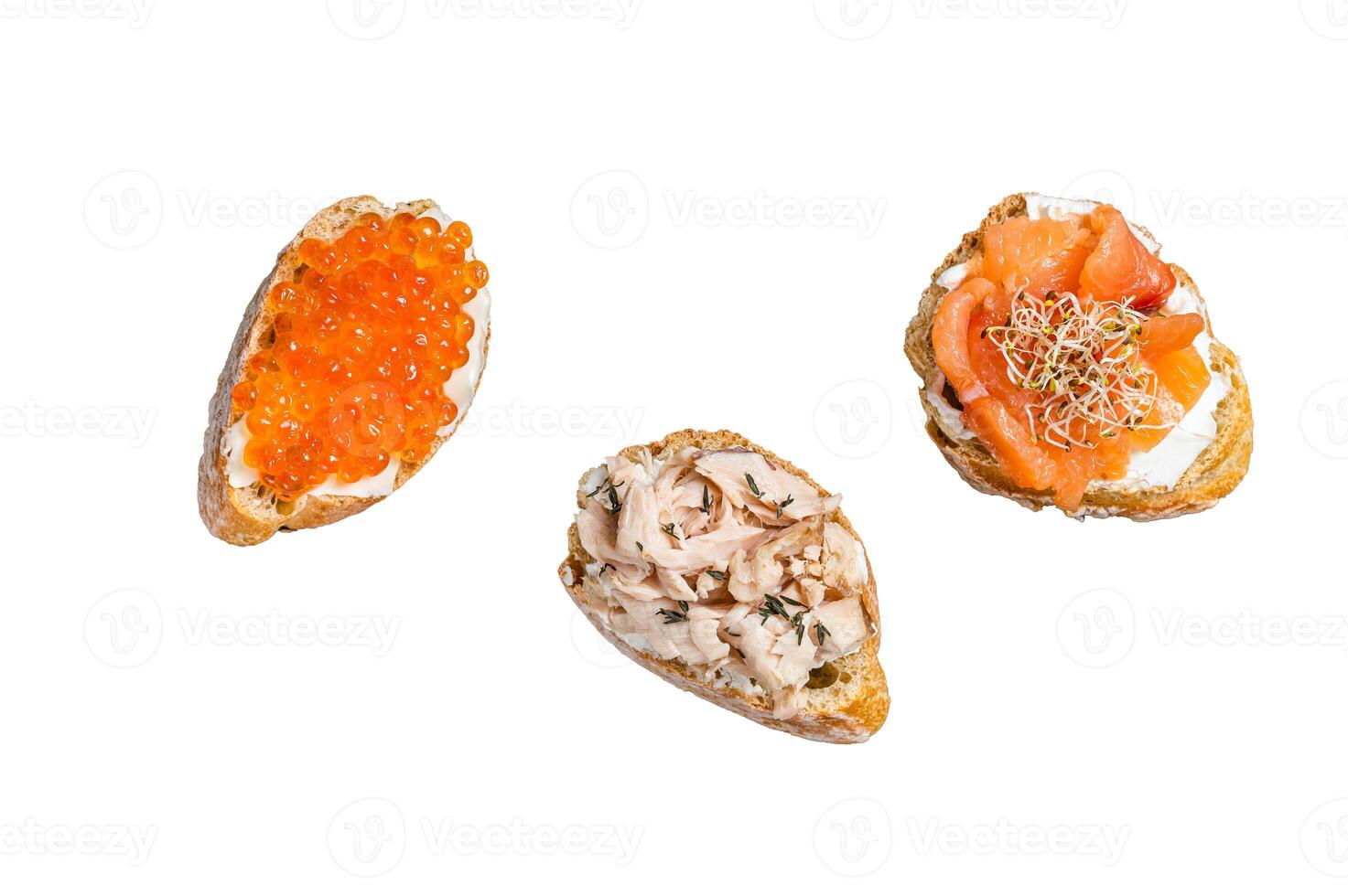 Bruschetta with Hot Smoked salmon, red caviar and herbs. Isolated on white background. photo