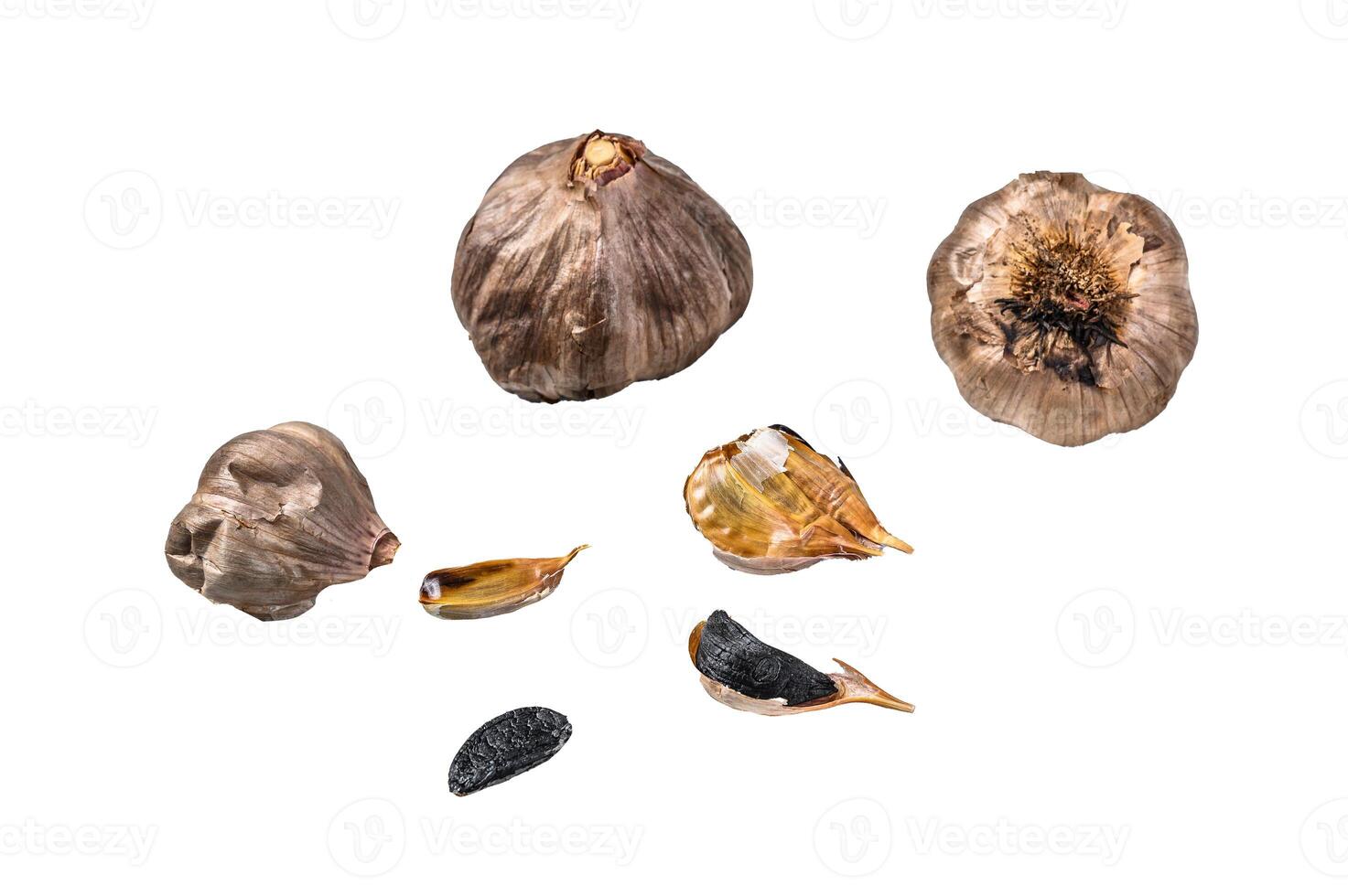 Whole balsamic fermented black garlic. Isolated on white background. photo