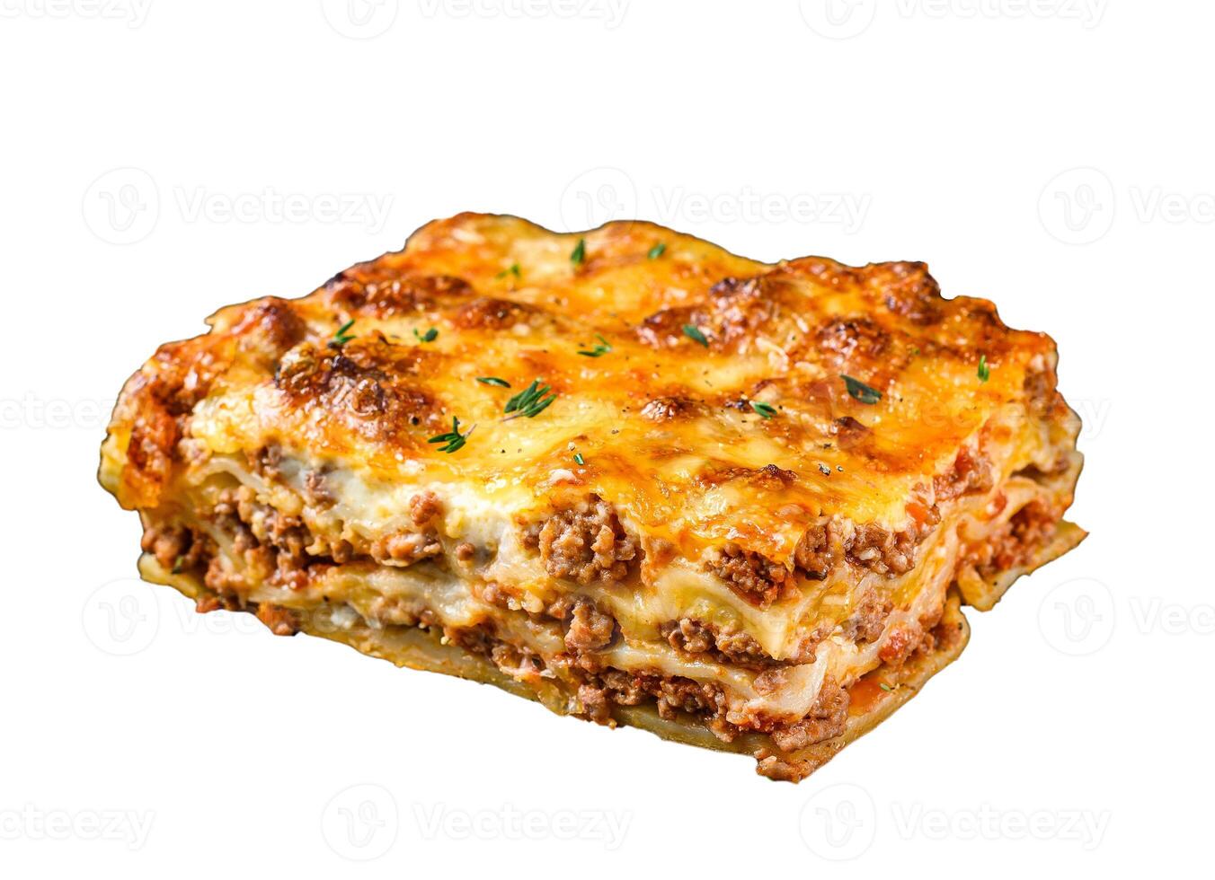 Lasagna with mince beef meat and tomato bolognese sauce on a plate. Isolated on white background. photo