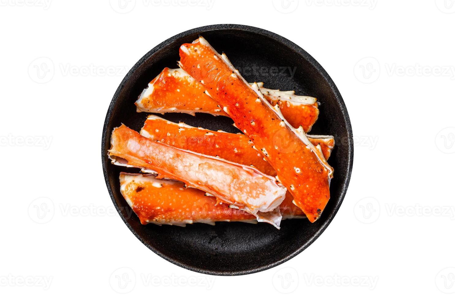 Alaskan King Crab legs Phalanx in a pan with herbs. Isolated, white background. Top view photo