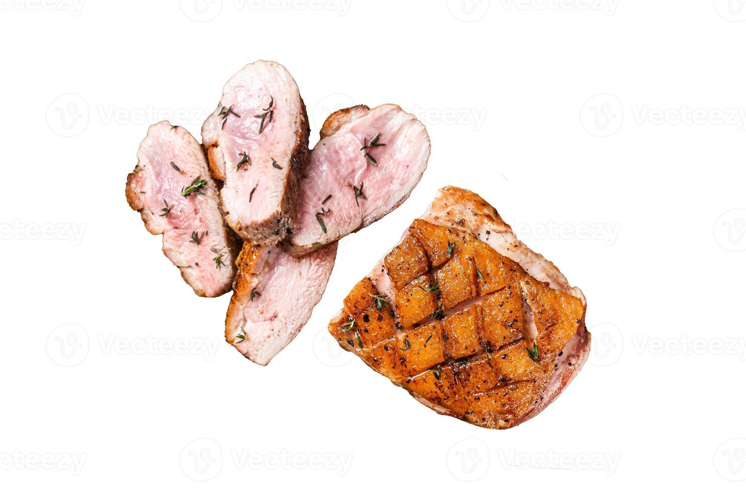 Sliced Duck breast fiilet, roasted steak with sauce. Isolated on white background, top view. photo