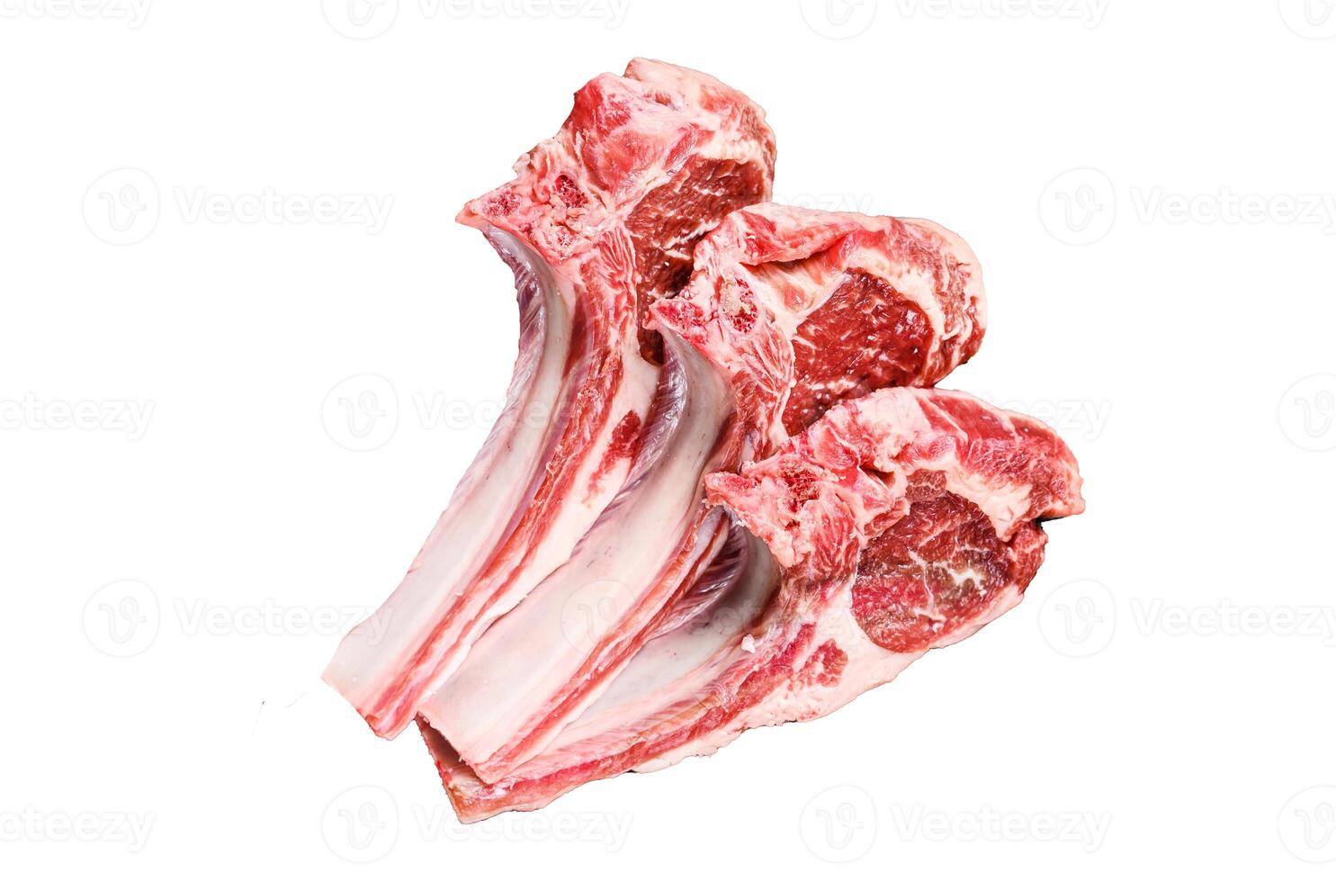 Lamb raw cutlets chops with salt, pepper and garlic. Isolated on white background, top view. photo