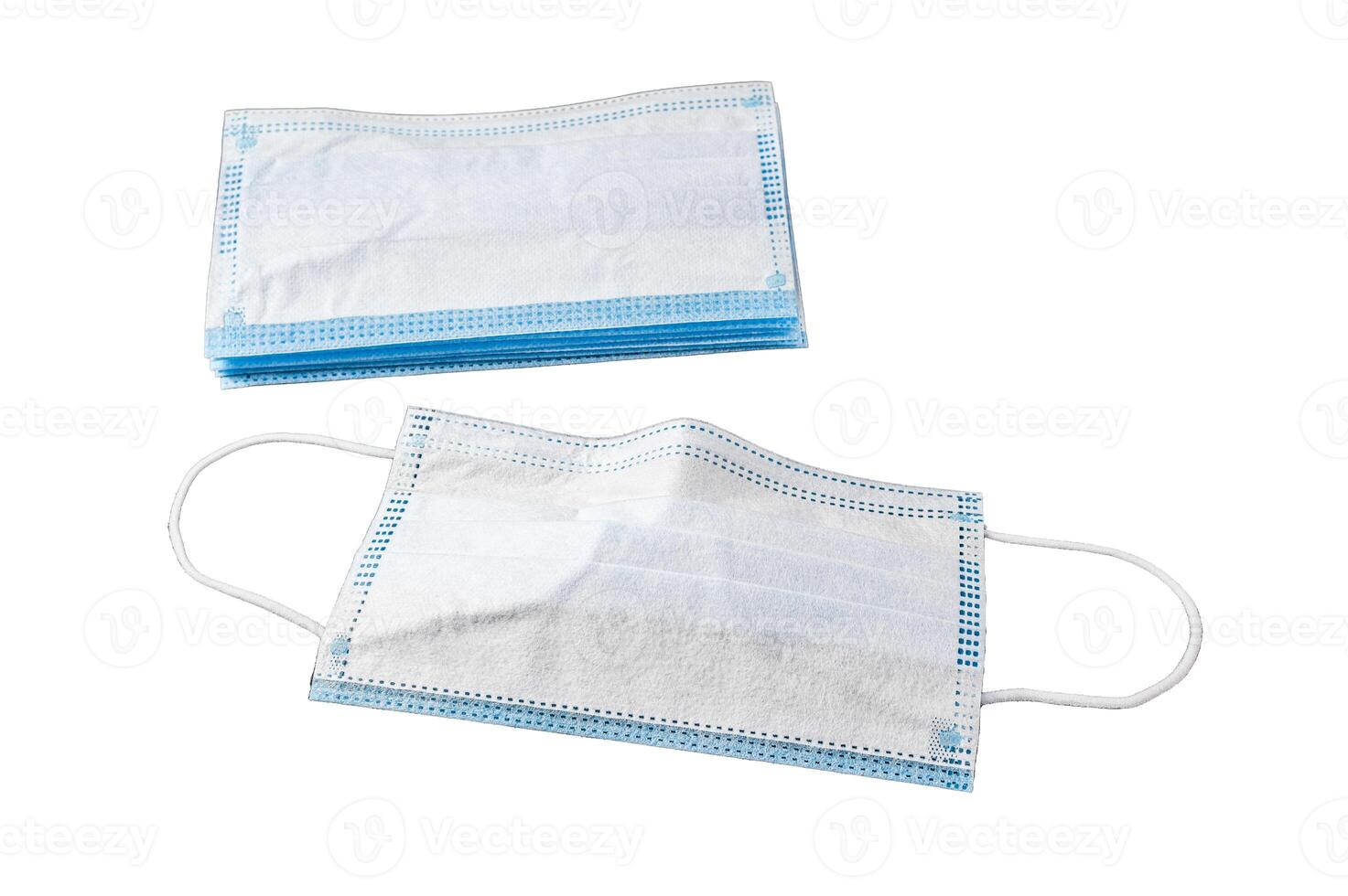 Doctor mask and corona virus protection. Disposable procedural face mask with malleable nose clip. Isolated on white background, top view. photo