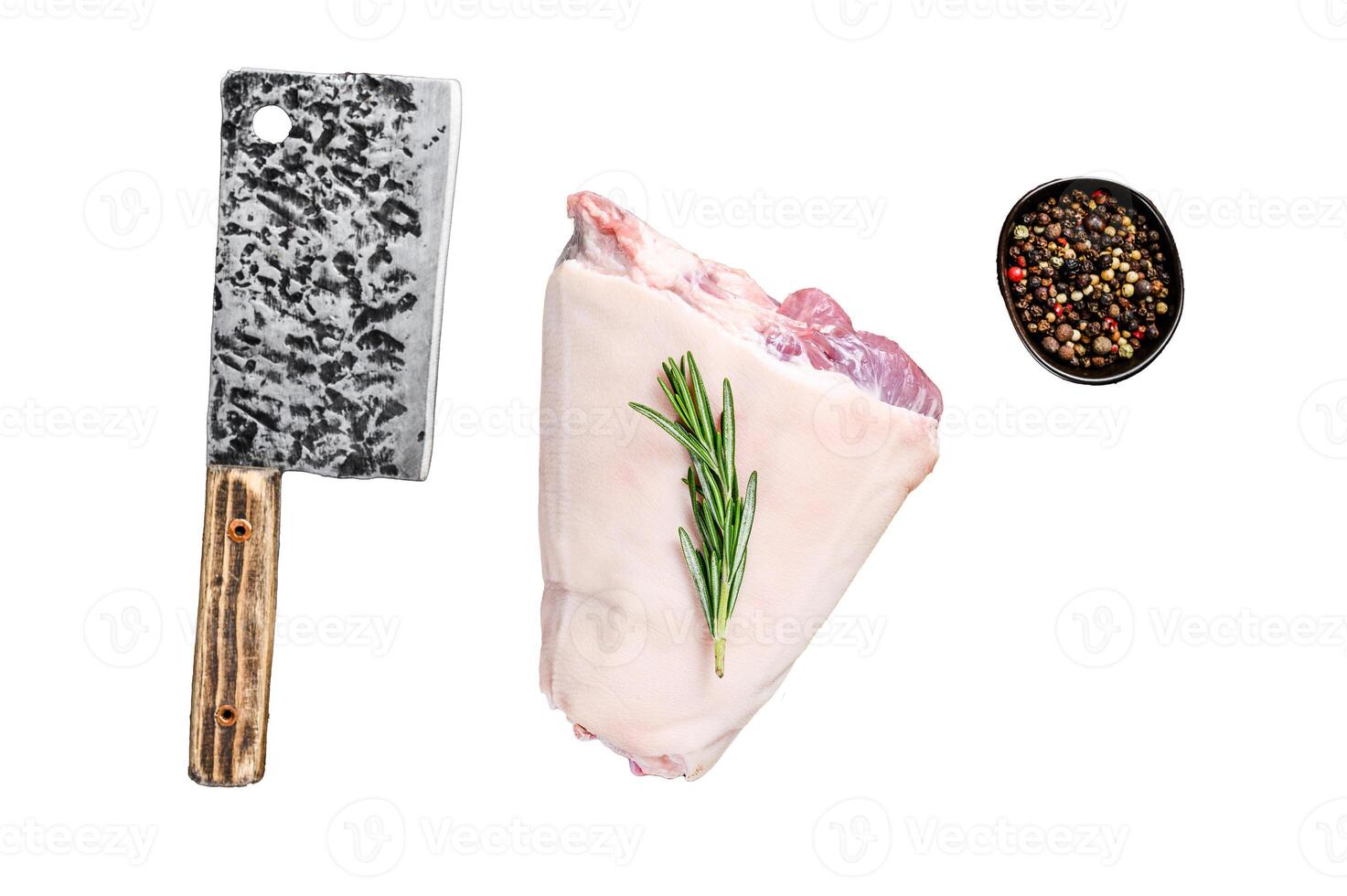 Raw pork Eisbein knuckle ham on a wooden board with meat cleaver. Isolated on white background photo
