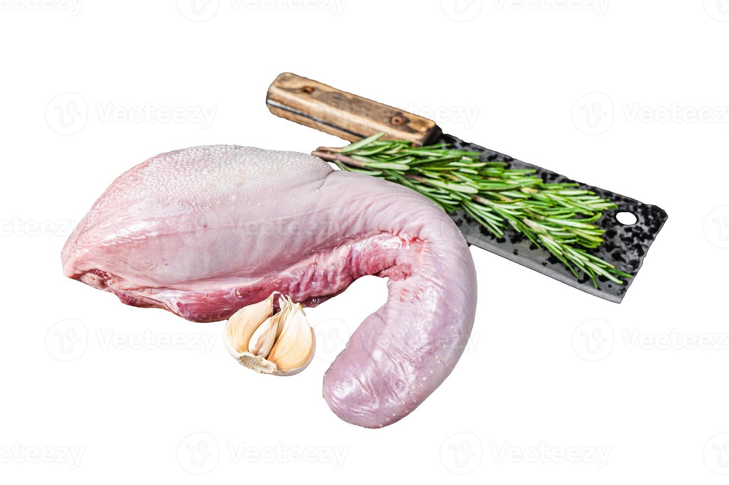Uncooked Raw beef or veal tongue on butcher board with meat cleaver. Isolated on white background. photo
