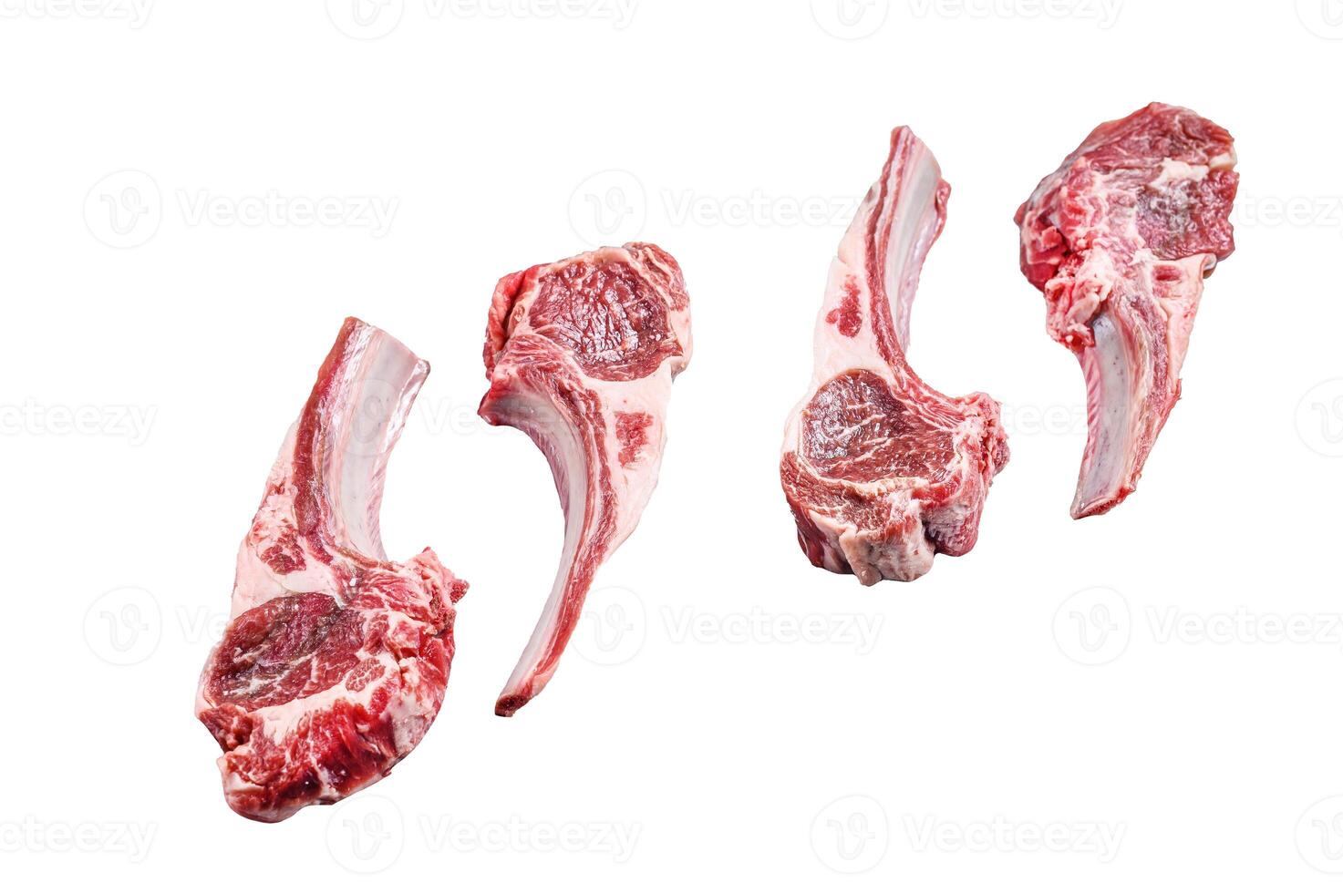 Raw lamb meat chops on a butcher table. Isolated on white background. photo