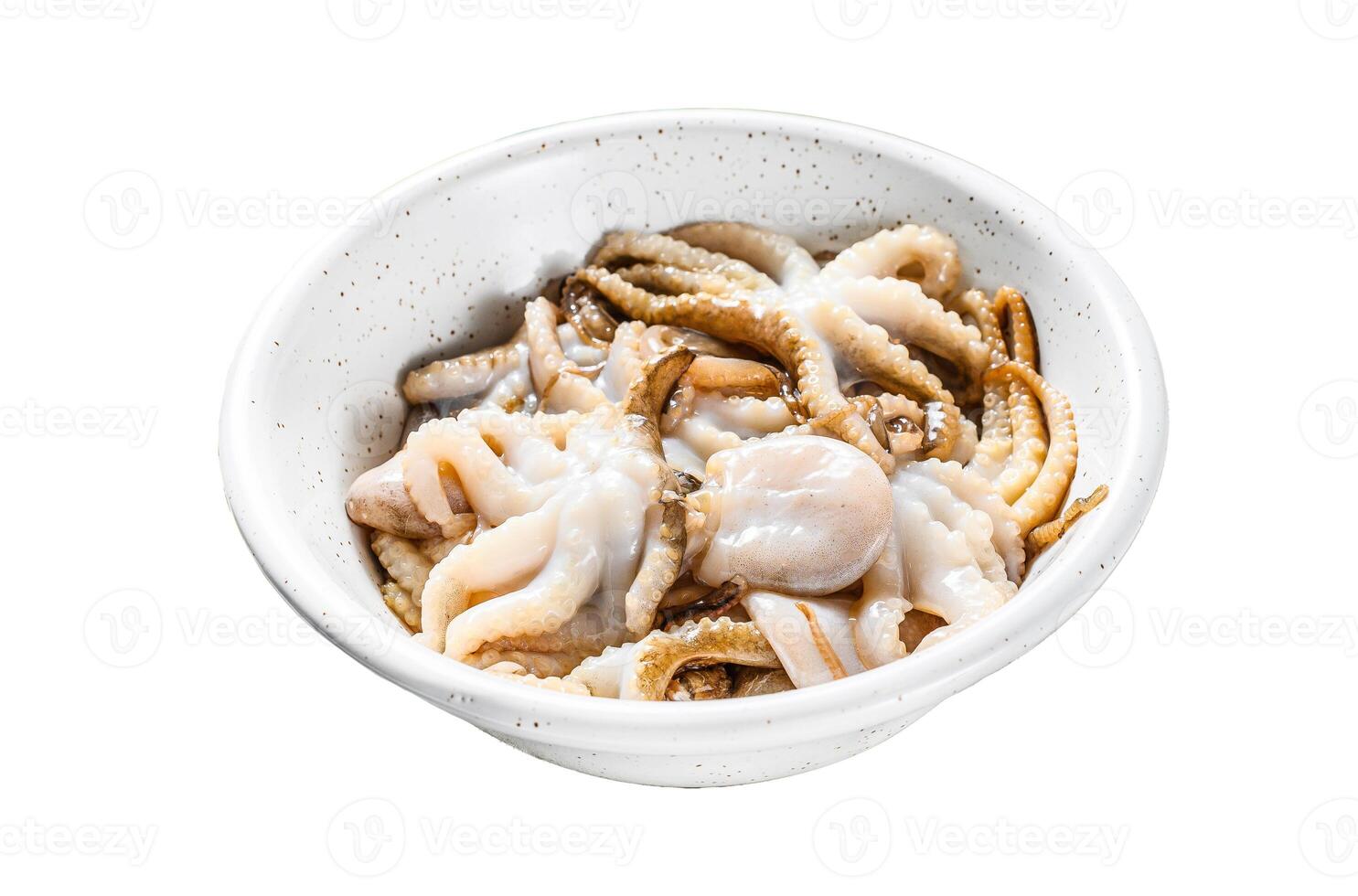 Raw baby octopus with parsley and lemon in a white bowl. Organic seafood. Isolated on white background. Top view. photo