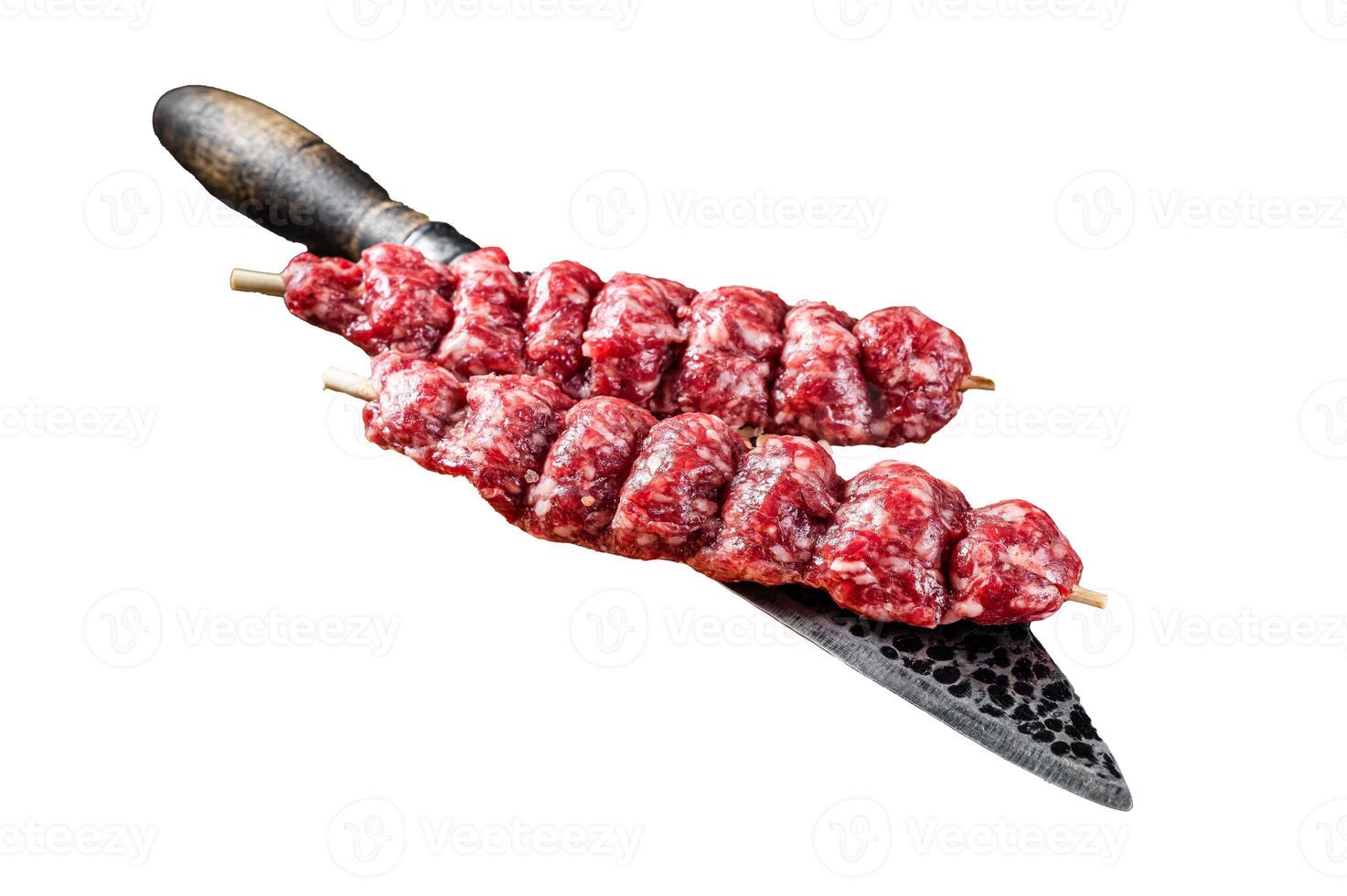 Raw kofta, kofte kebab Skewers with beef and lamb meat and spices. Isolated, white background. photo