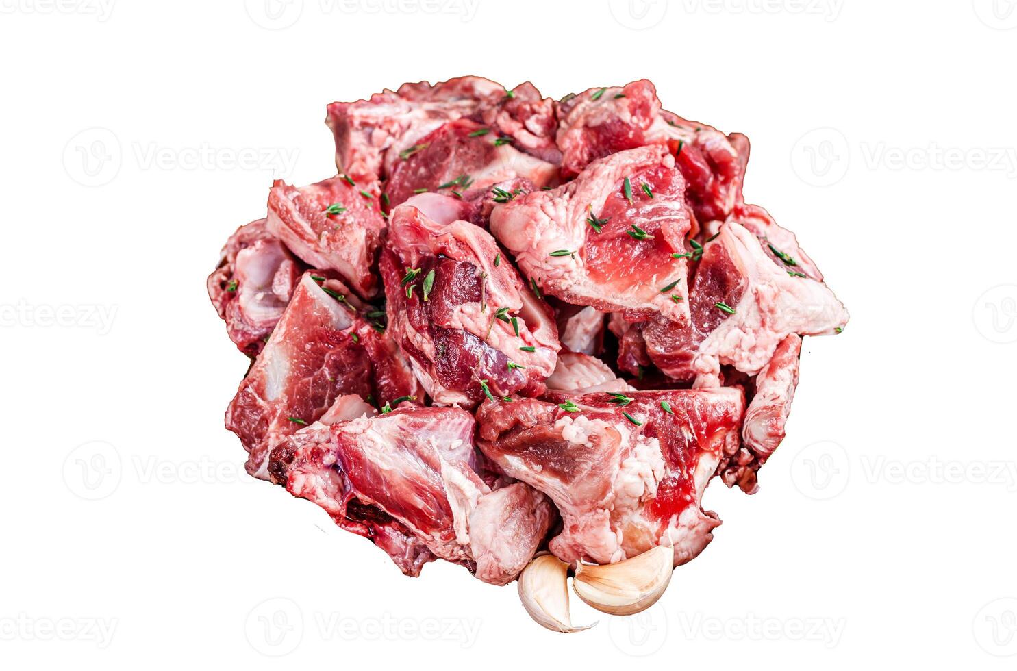 Raw mutton meat diced for goulash or stew with bone Isolated on white background, top view. photo
