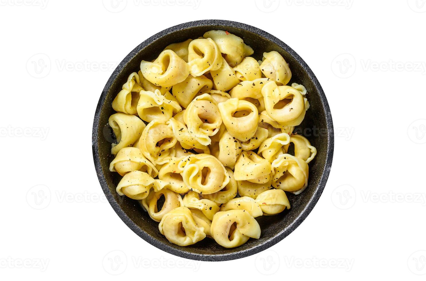 Italian tortellini pasta with cheese sauce in a pan. Isolated on white background. photo