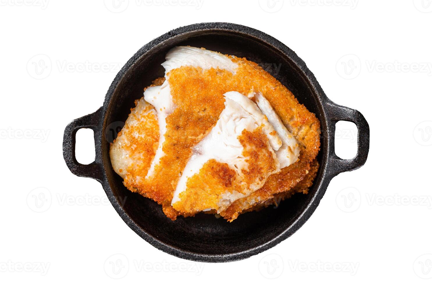 Roasted tilapia fillet in a skillet with breadcrumbs. Isolated, white background. photo