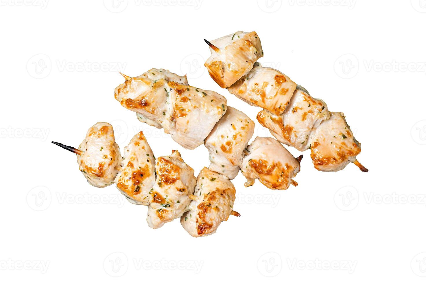 Chicken shish kebab, grilled skewers with herbs and spices on a rack. Isolated, white background. photo