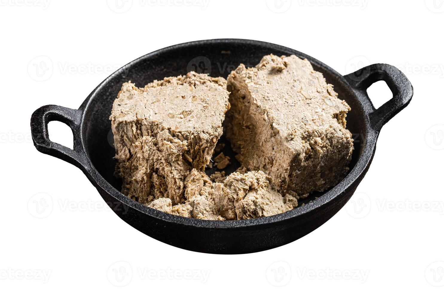 Halva with sunflower seeds and honey in pan. Isolated on white background. Top view. photo