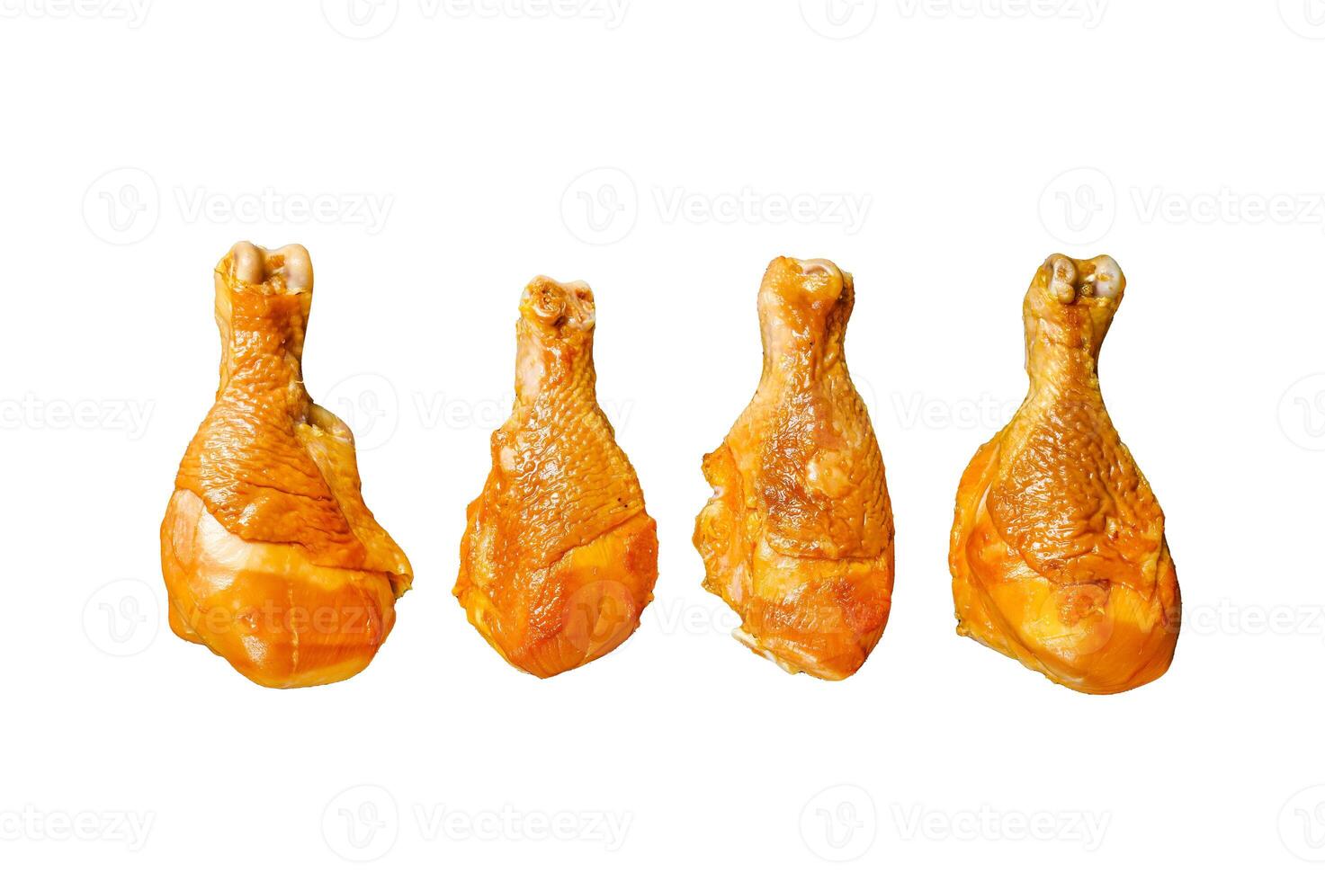 Spicy Smoked chicken leg drumsticks on a kitchen table. Isolated on white background, top view. photo