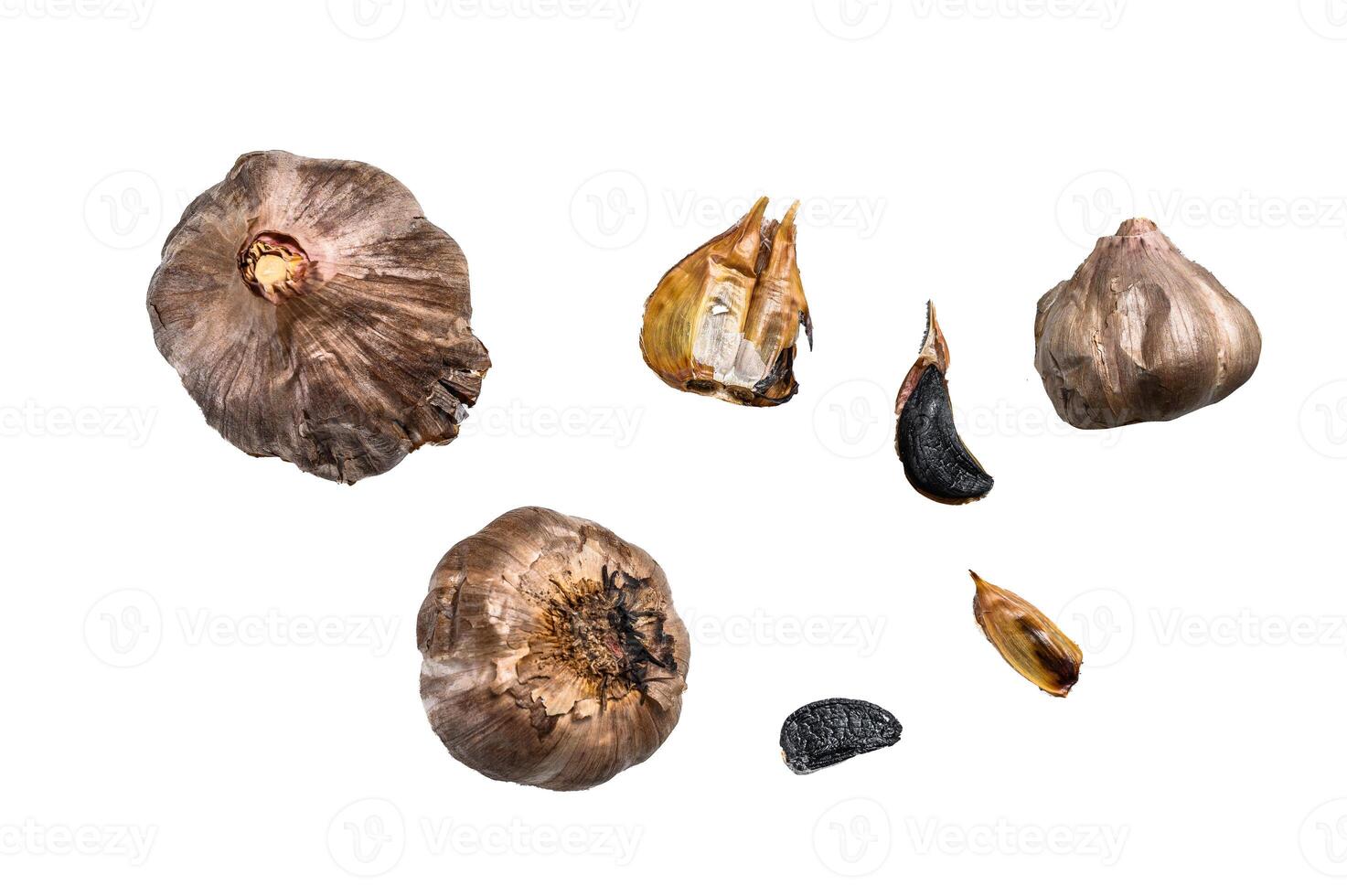 Whole balsamic fermented black garlic. Isolated on white background. photo