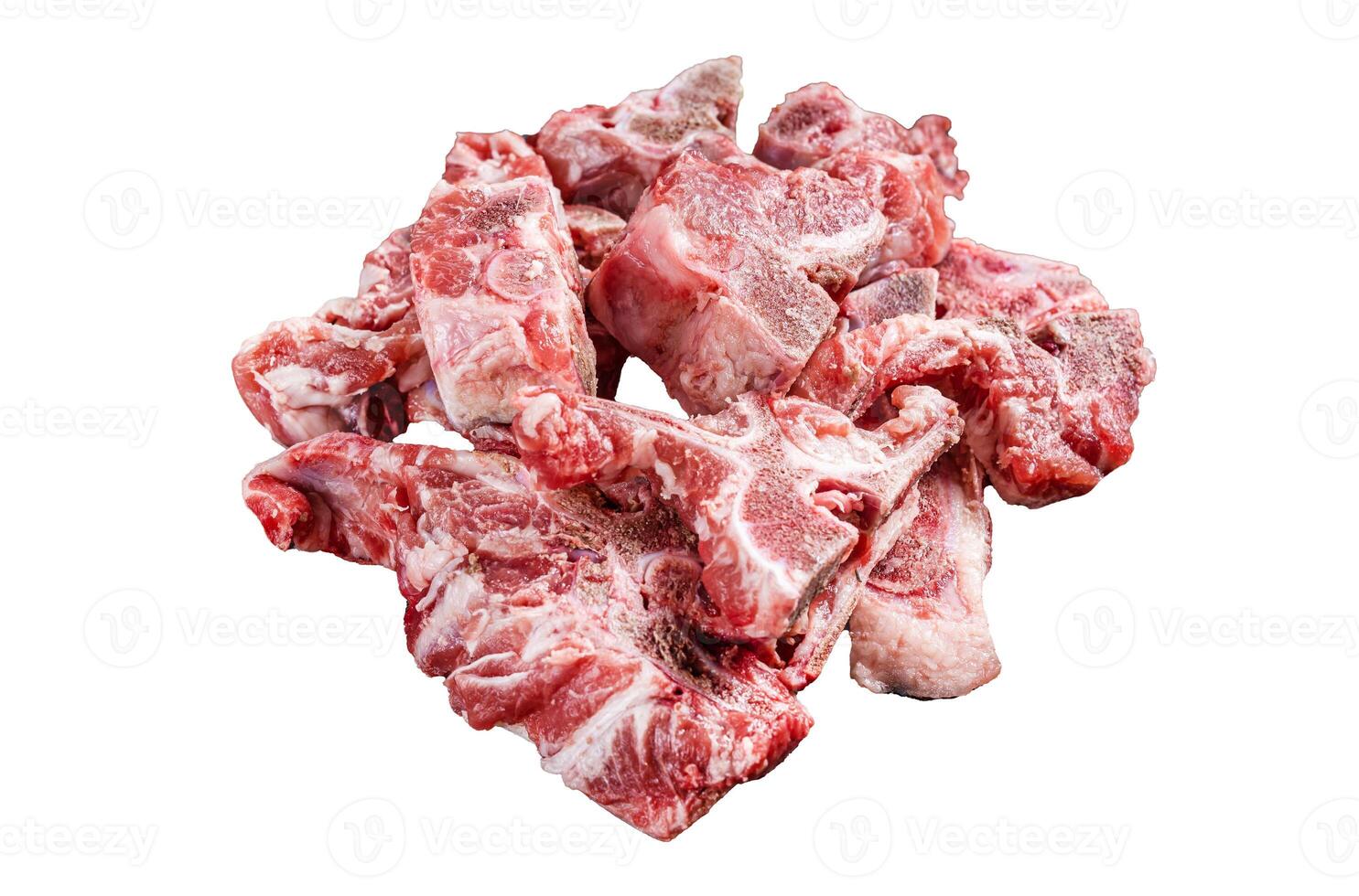 Uncooked Raw meat diced for stew on a butcher board. Isolated, white background. photo