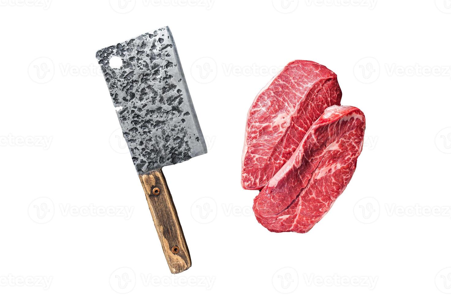 Uncooked Raw Shoulder Top Blade or flat iron beef meat steaks on a wooden butcher board with meat cleaver. Isolated, white background. photo