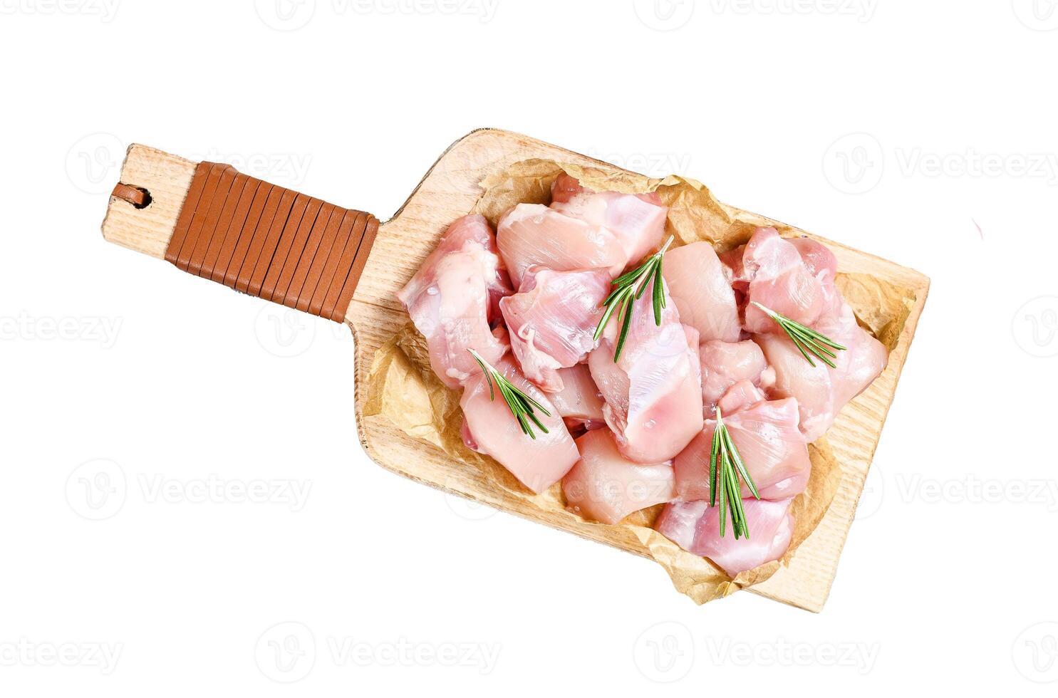 raw chicken fillet cut into cubes with spices. Isolated on white background. Top view. photo