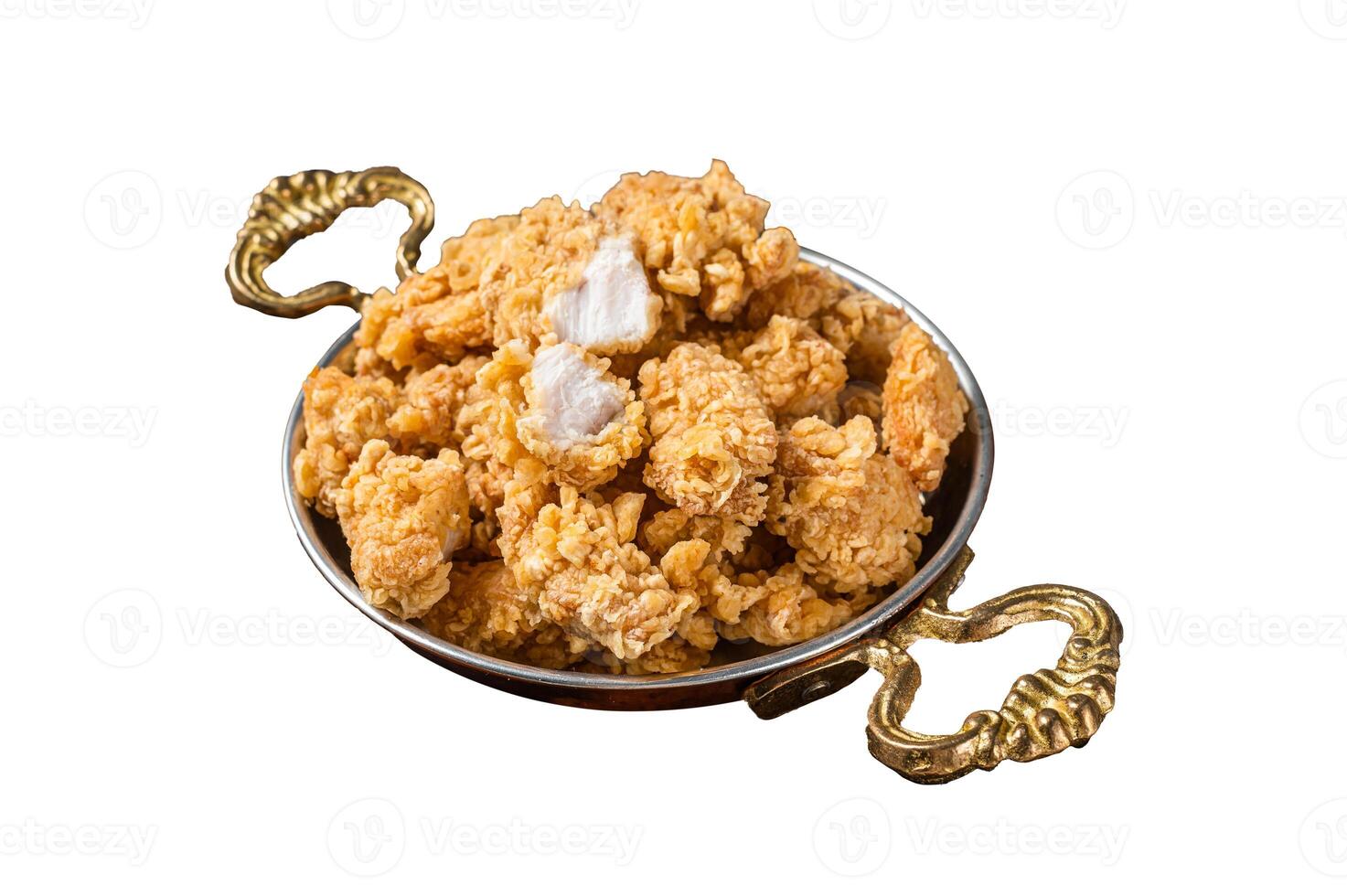 Homemade Crispy Popcorn Chicken bites in a skillet Isolated on white background. photo