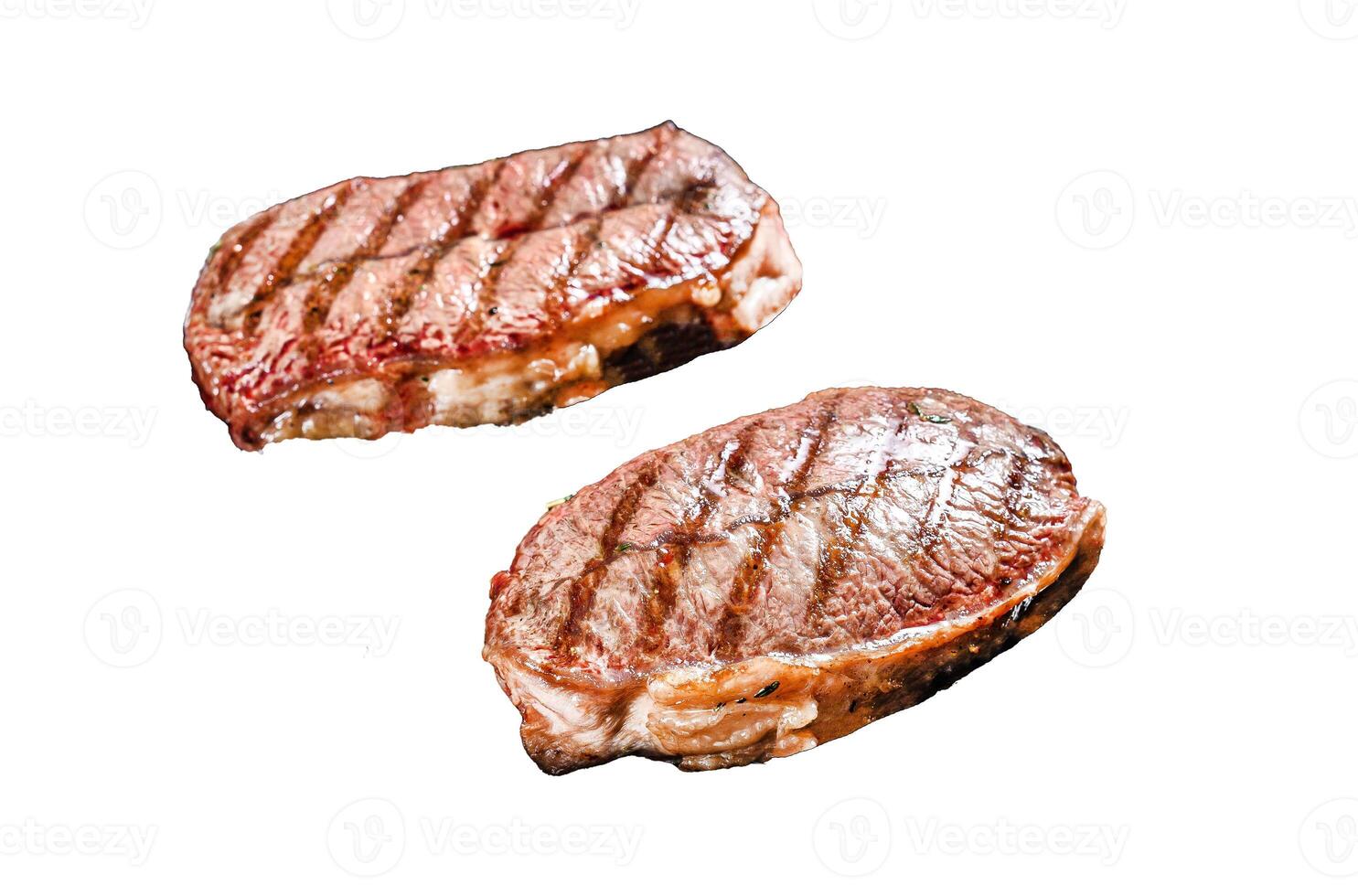 Grilled meat Top Blade steaks Isolated on white background. Top view. photo