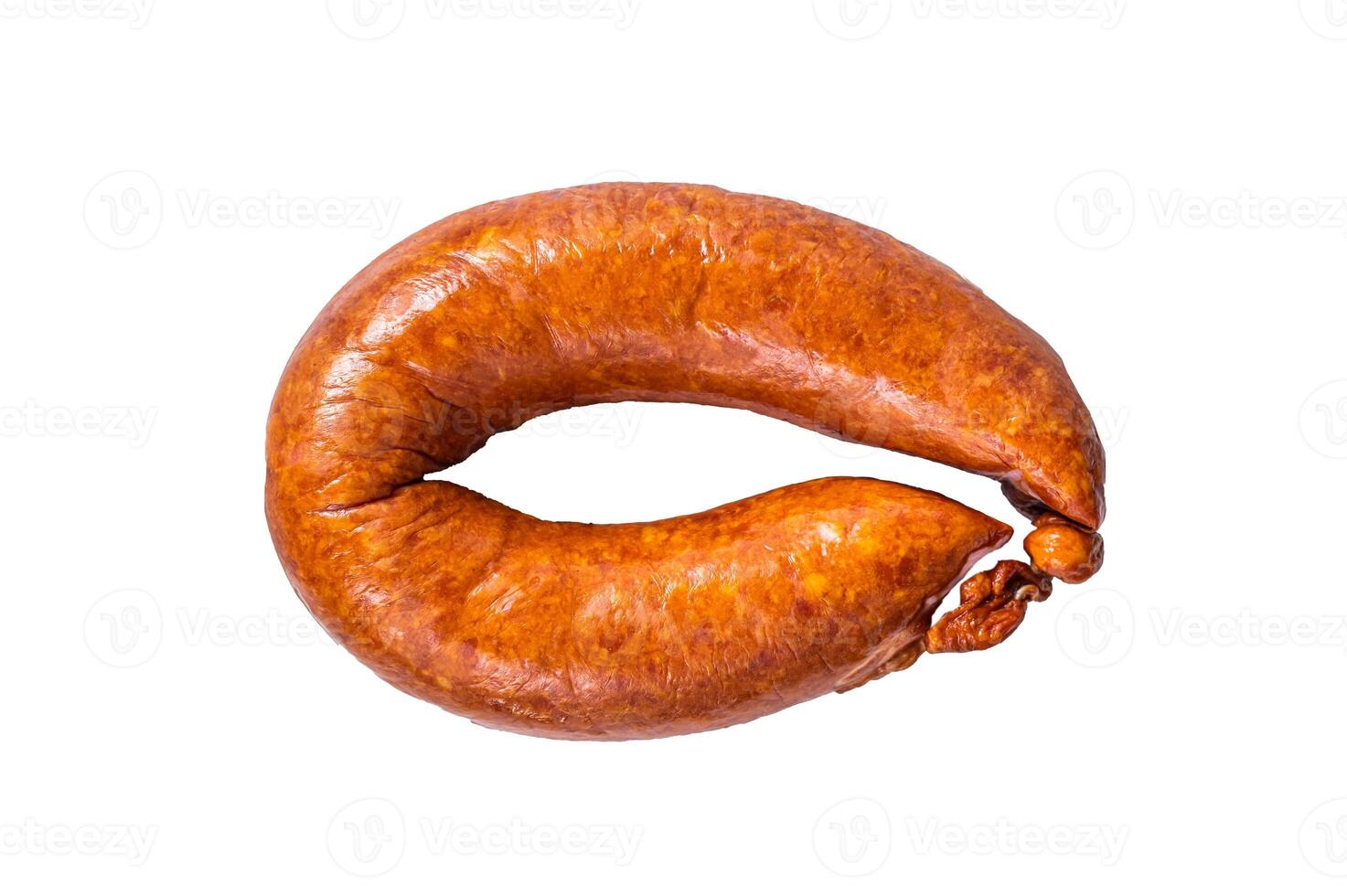 Smoked sausage on a white rustic table. Isolated on white background. photo