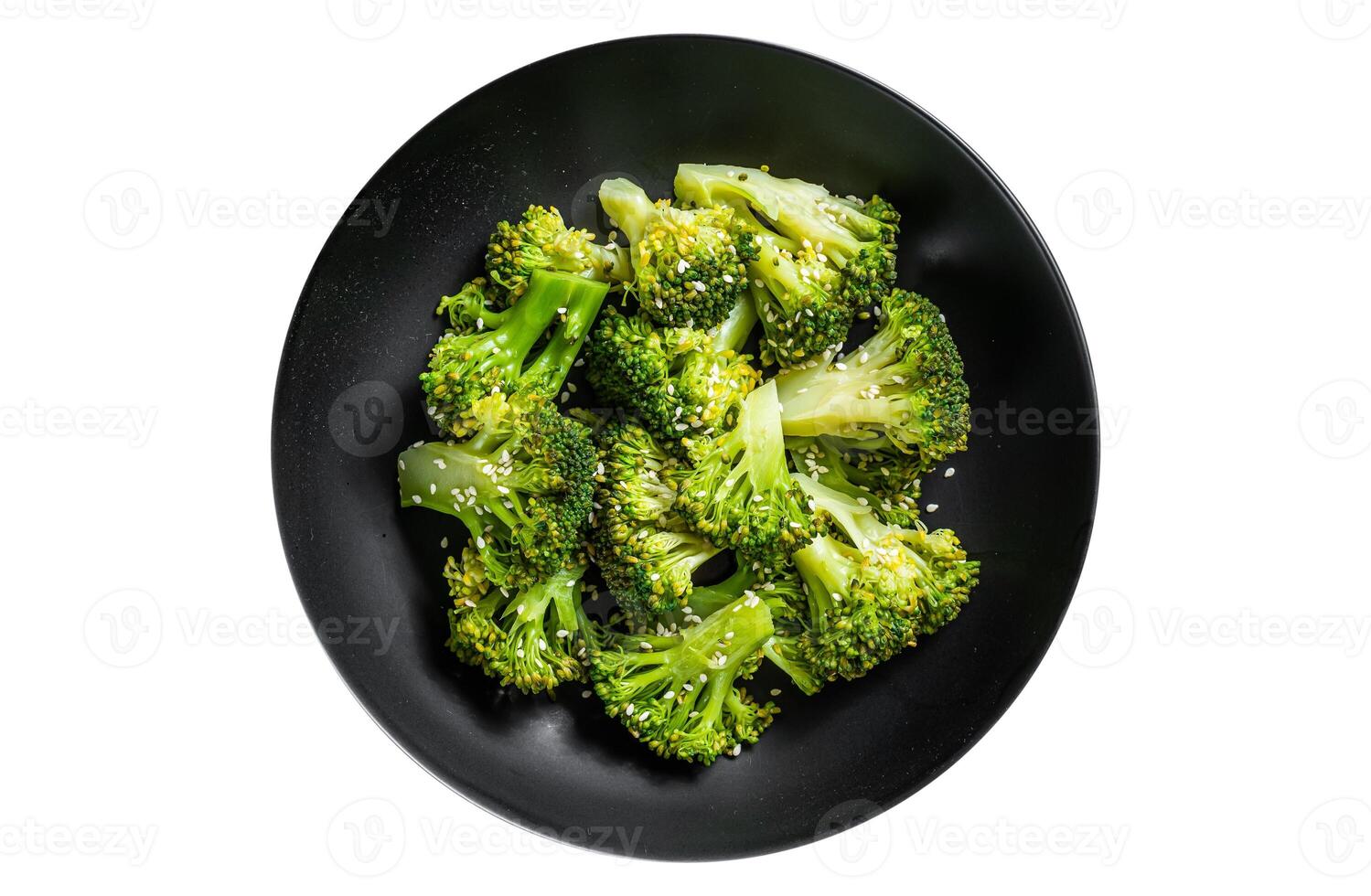 Boiled broccoli with spices in a plate. Isolated, white background. Top view. photo