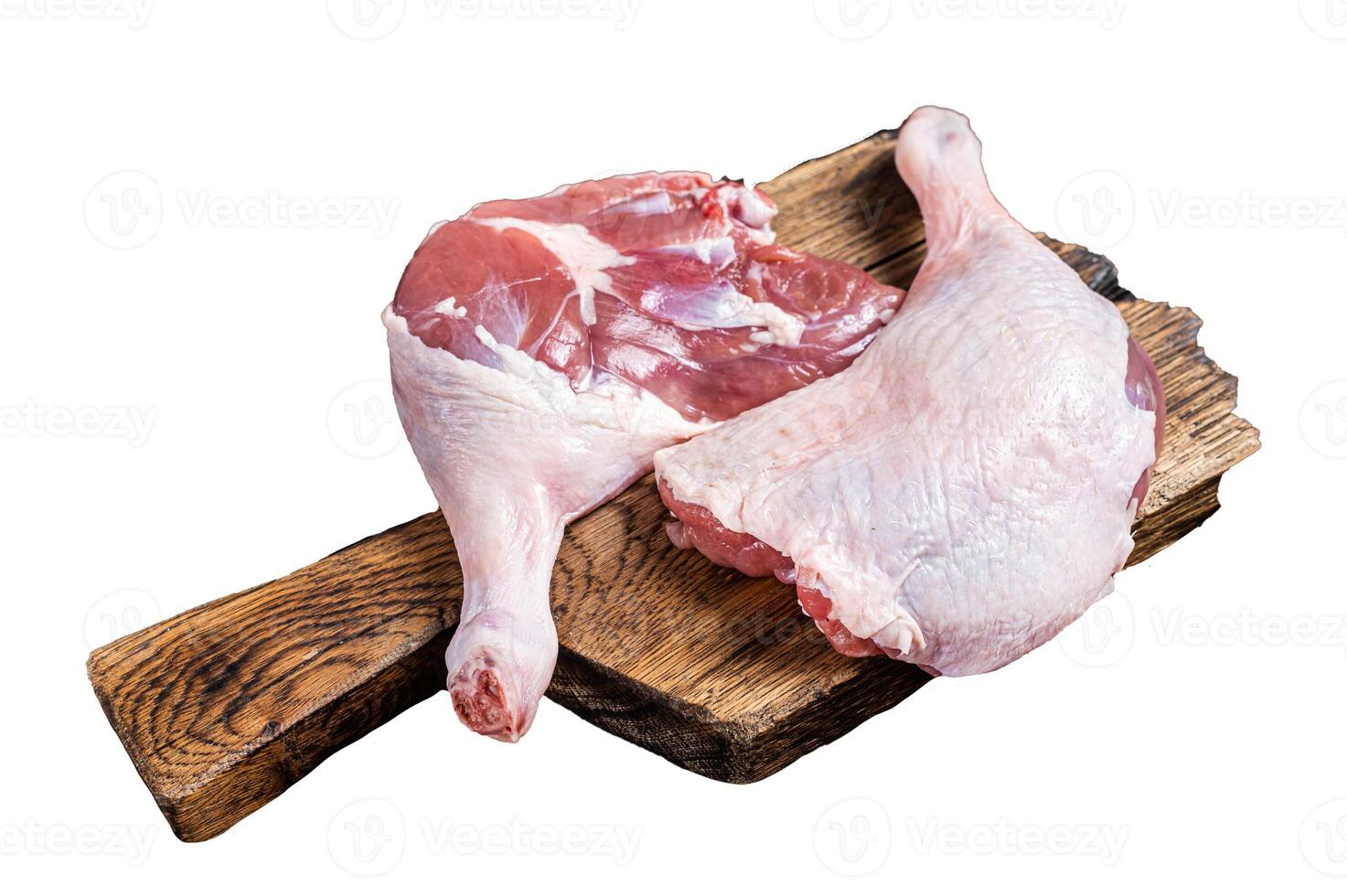 Uncooked Raw duck legs, Poultry meat on a wooden board. Isolated, white background. photo