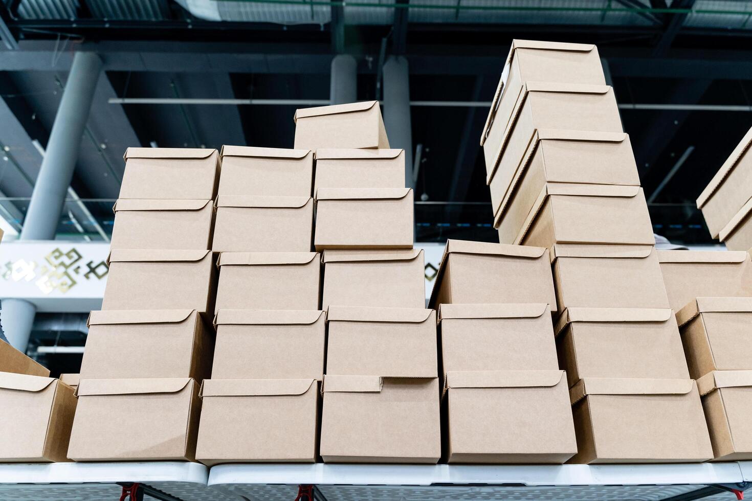 A collection of stacked cardboard boxes neatly organized within a modern storage facility designed for efficient inventory management and logistics photo