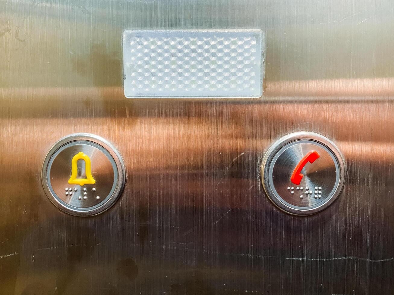 The elevator is equipped with both a bell for signaling and a button designated for telephone communication, enhancing user accessibility and convenience during operations photo