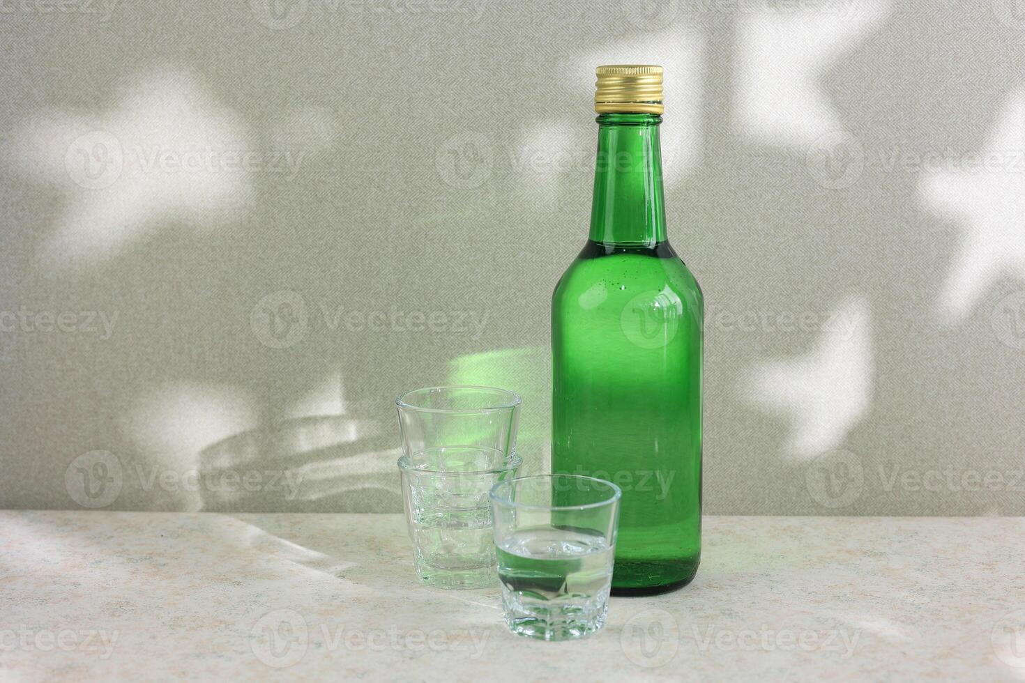 A Bottle of Soju with Small Glass for Sharing photo