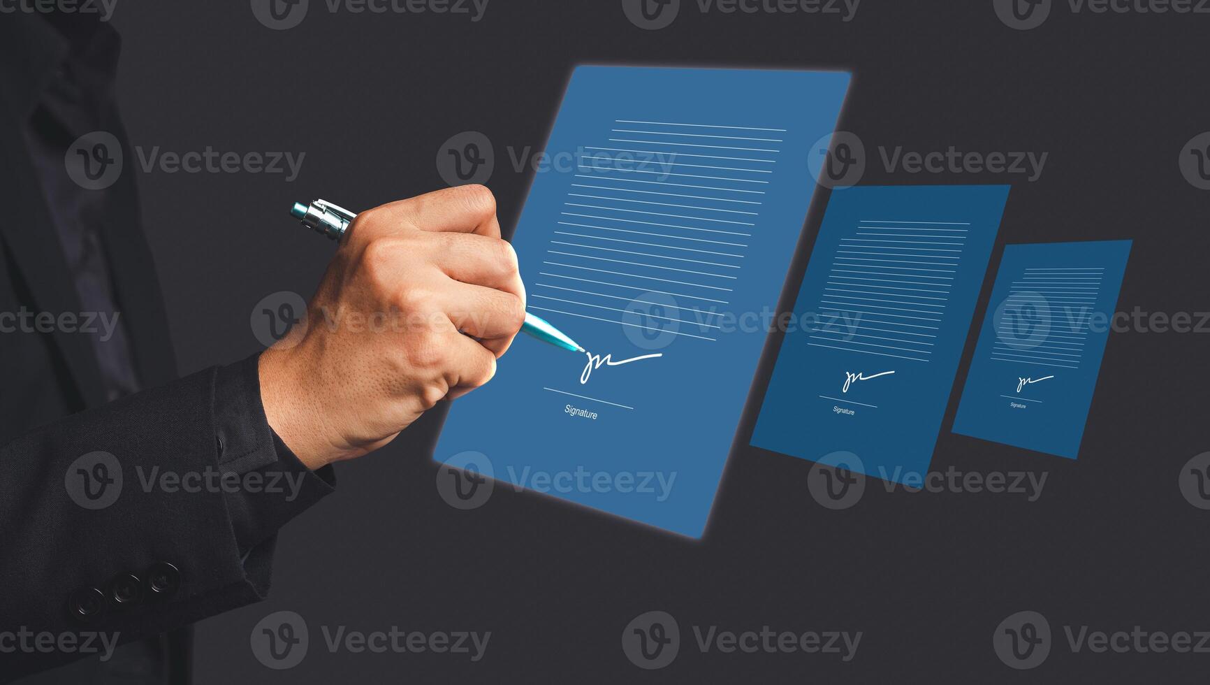 A businessman using a pen signing electronic documents on digital documents on a virtual screen photo